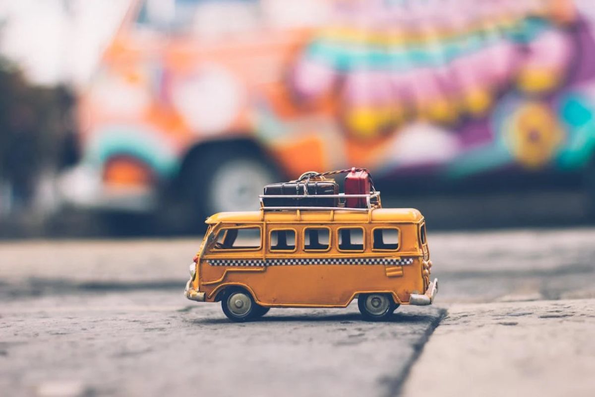 A toy bus with luggage on top