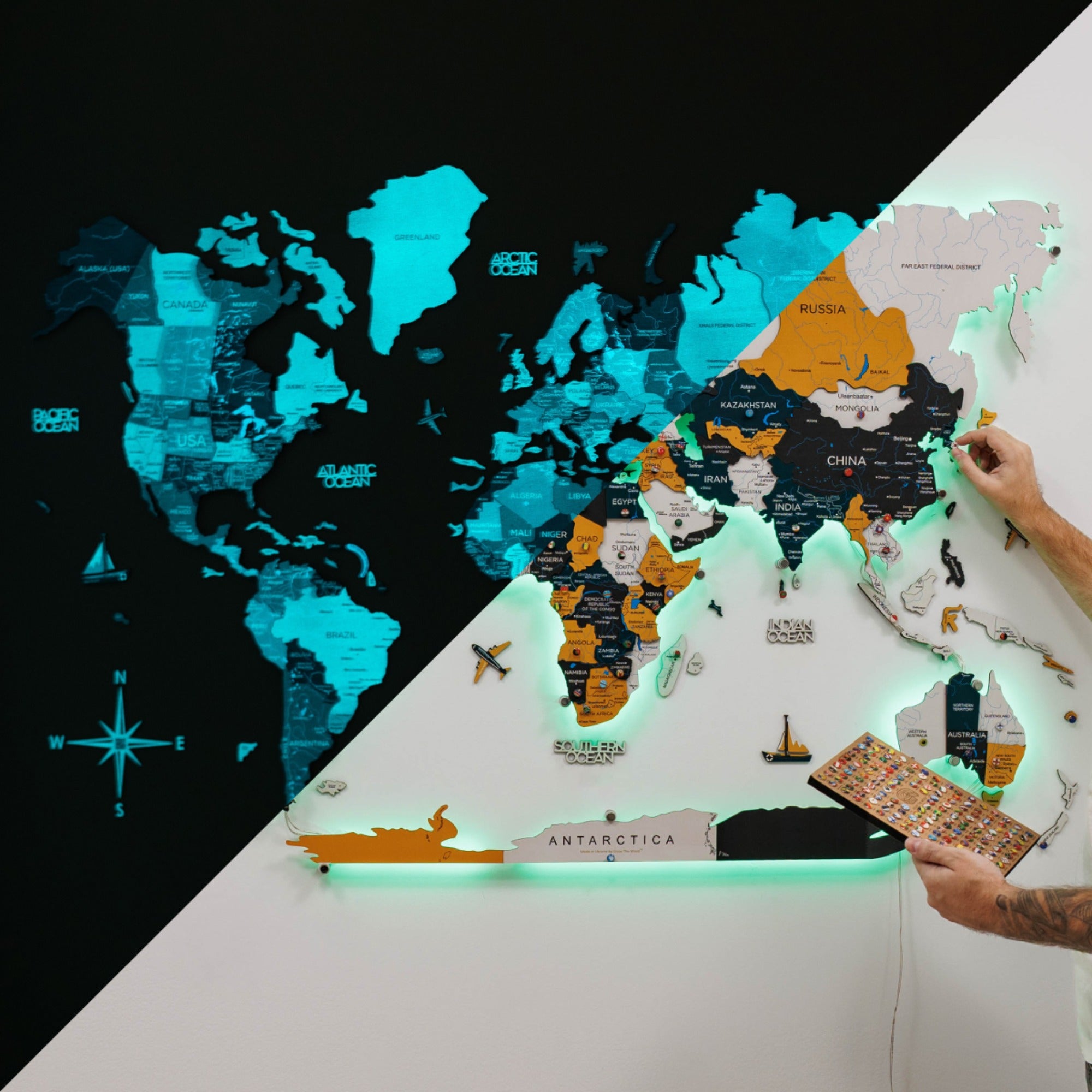 World map with glowing edges, showing a close-up of a hand holding a map on a black and white background.