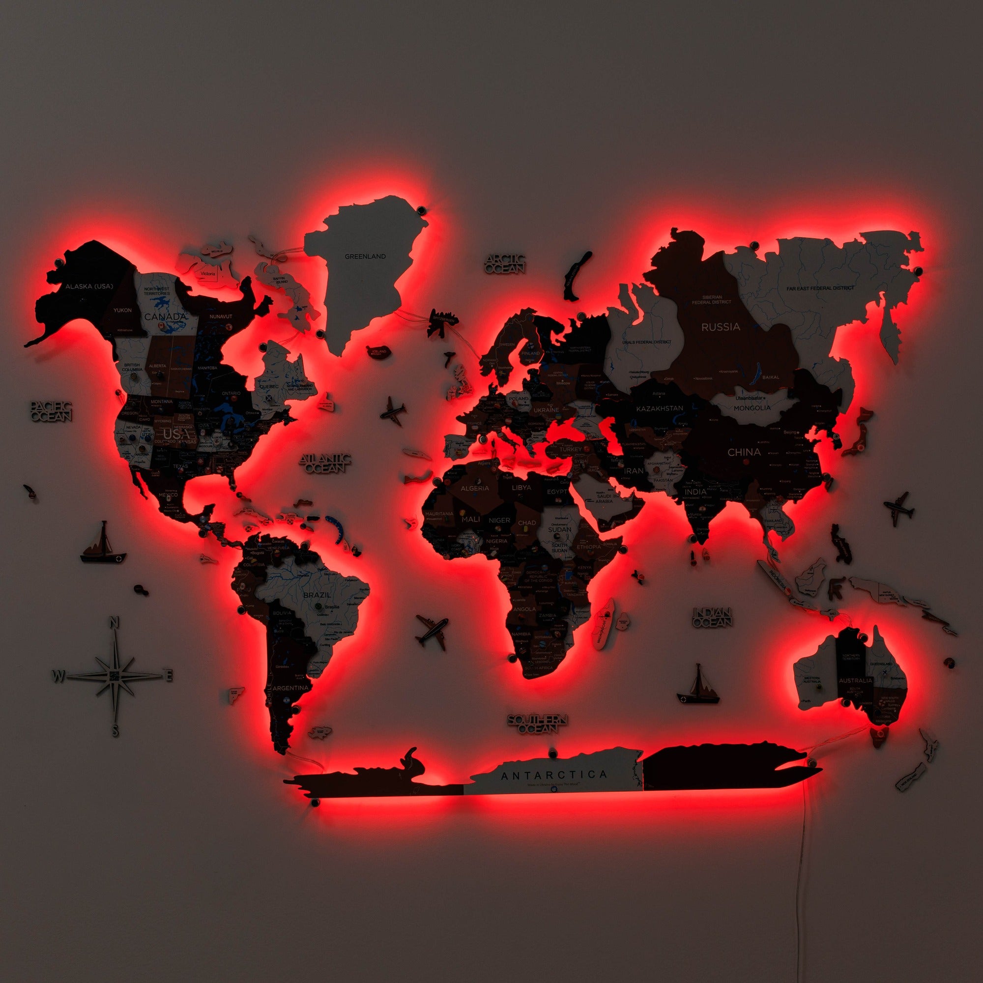 World map with red neon lighting on a dark background