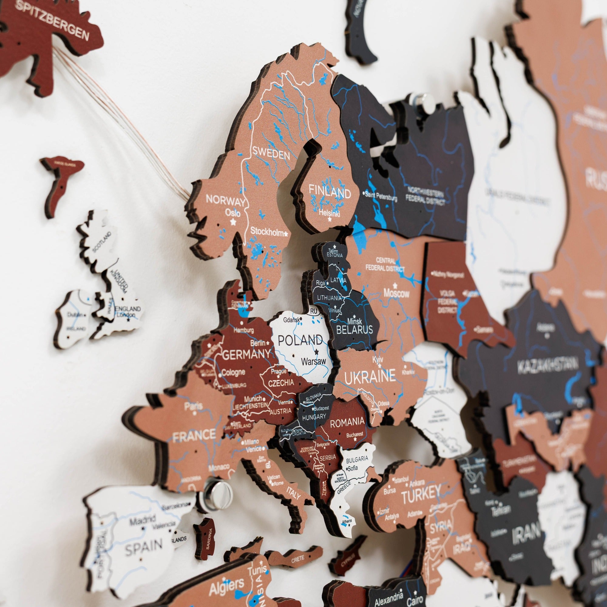Wooden map of Europe with country names on a white background