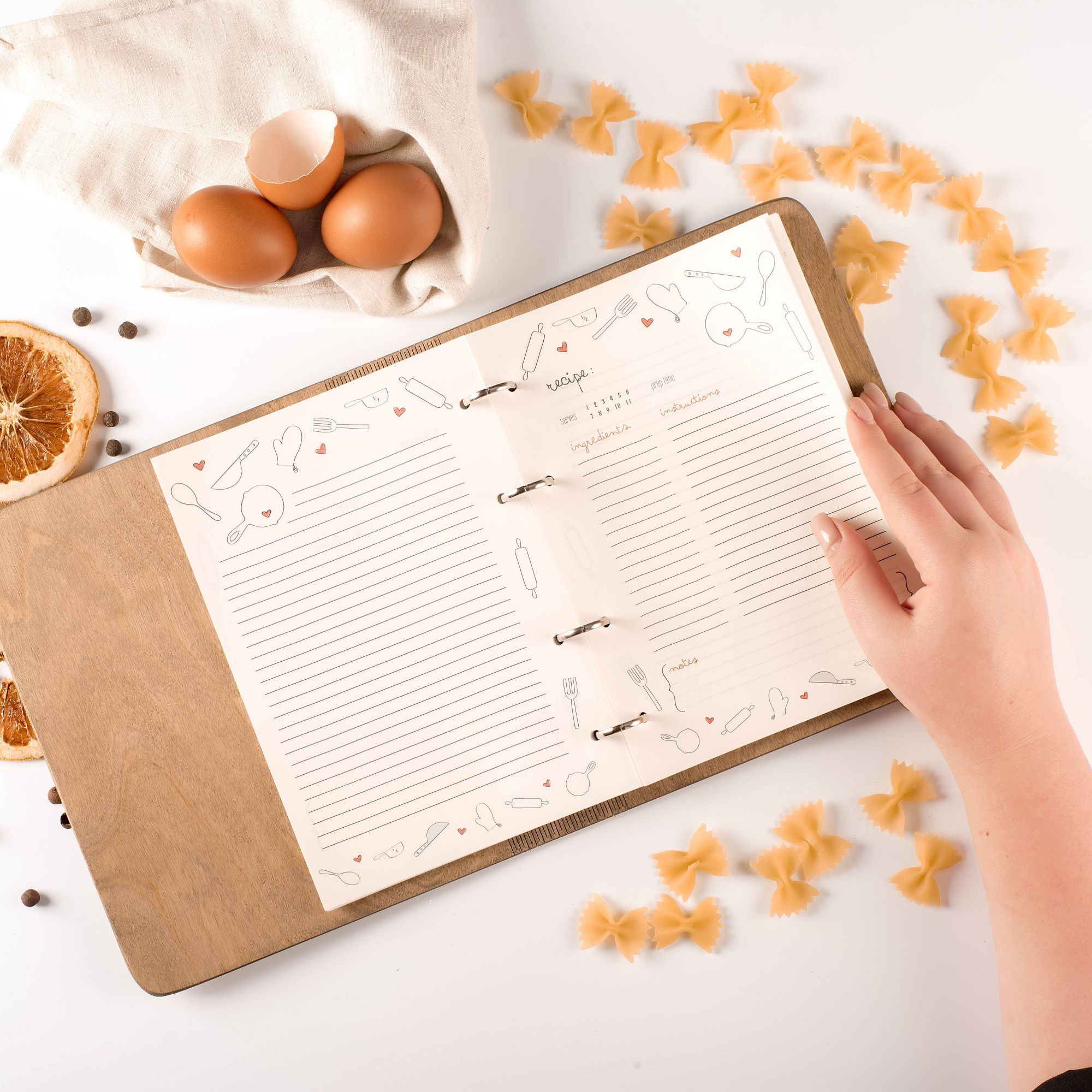 Open recipe notebook with decorated pages for writing recipes