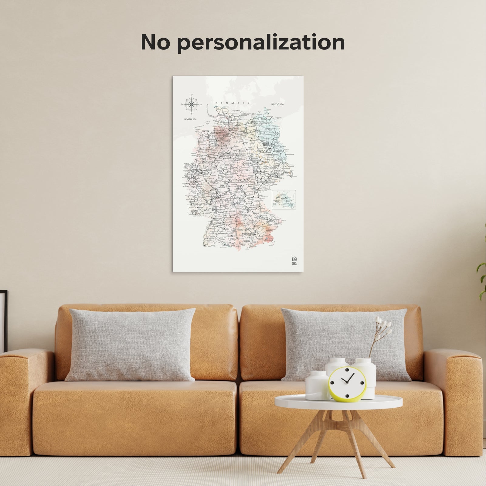 Framed map of Germany on a wall above a brown sofa with decorative items.