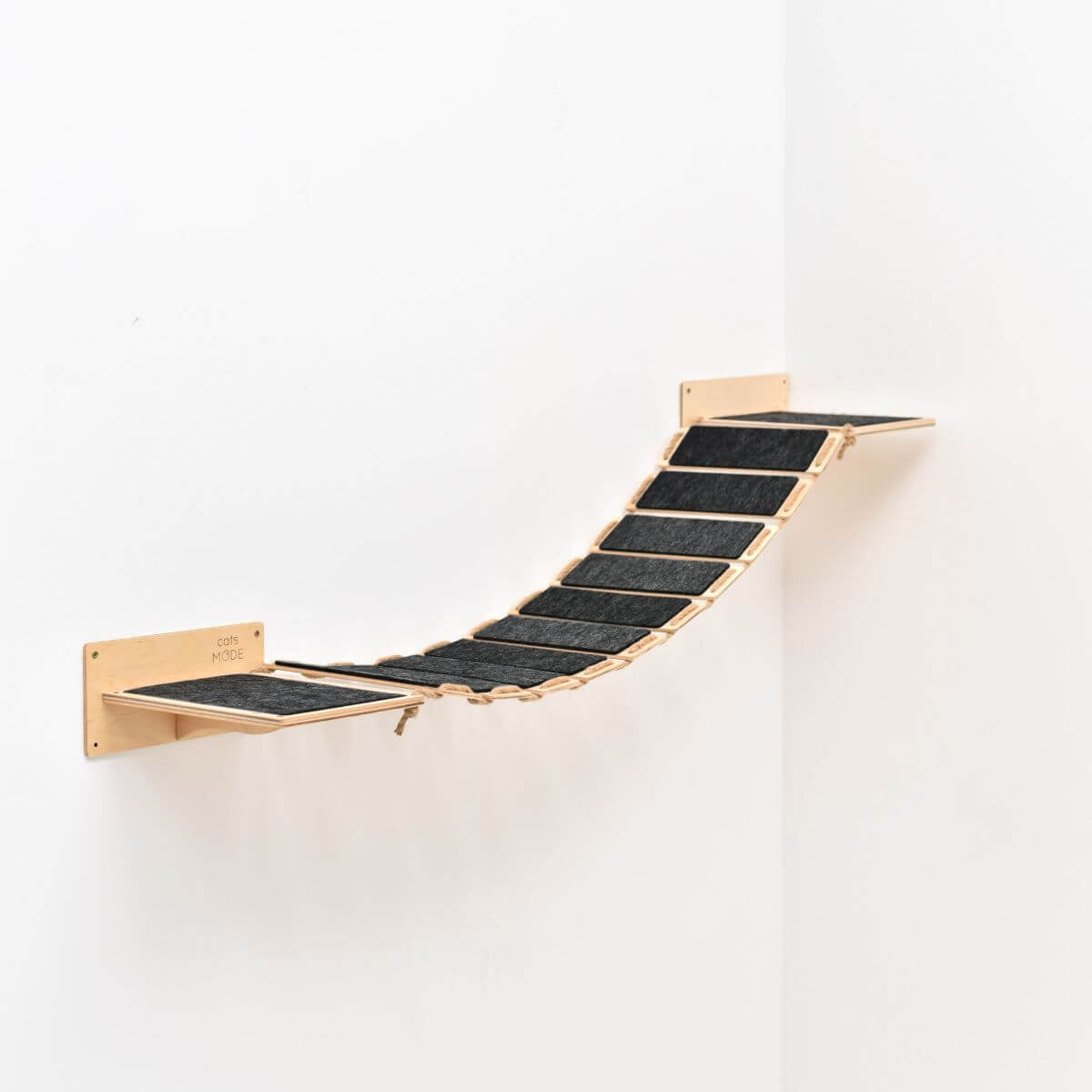 wall cat bridge in light wood color covered with black felt