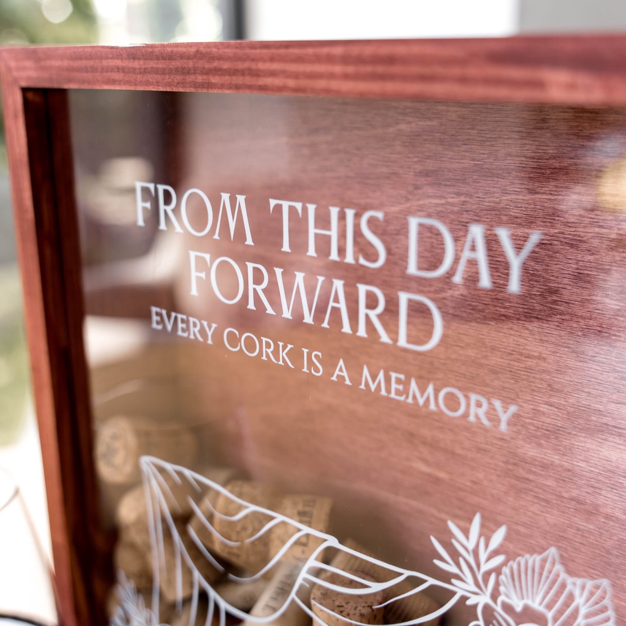 Close-up of a wooden keepsake box with a glass front