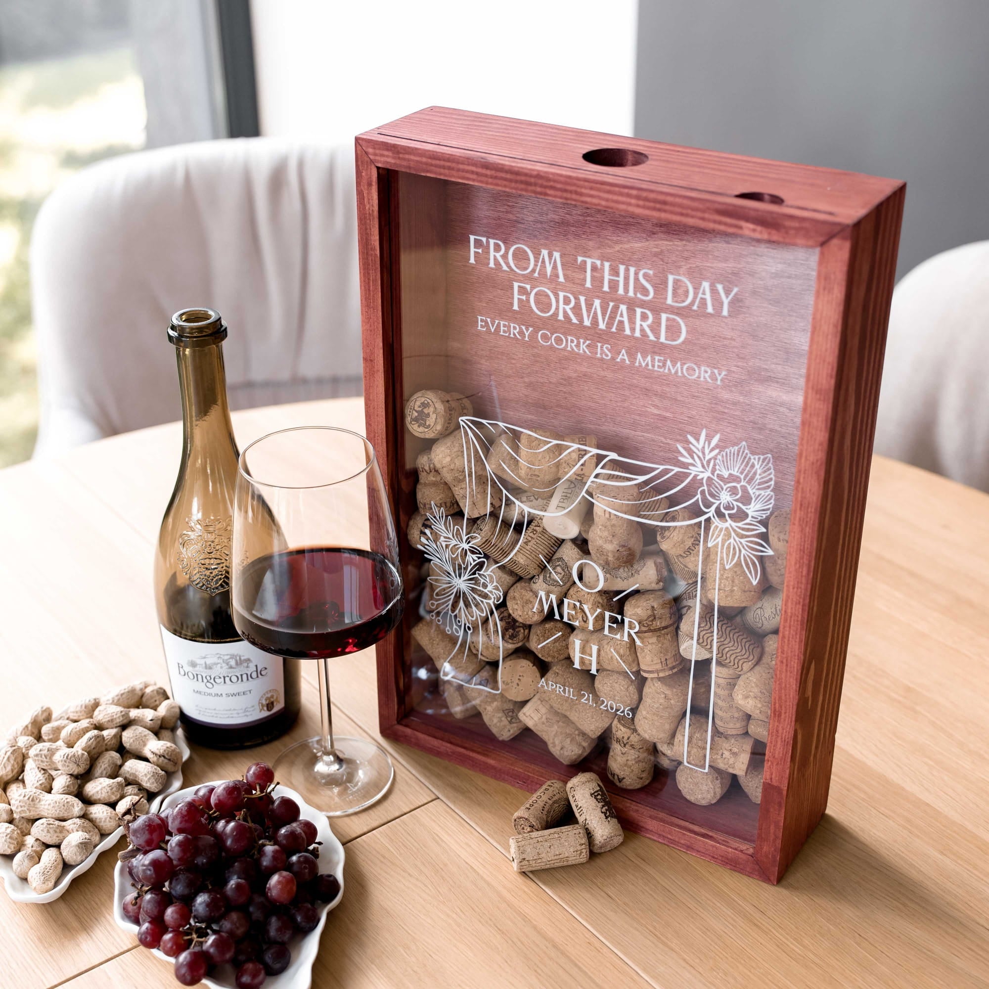 A personalized wooden wine gift box with a clear front panel
