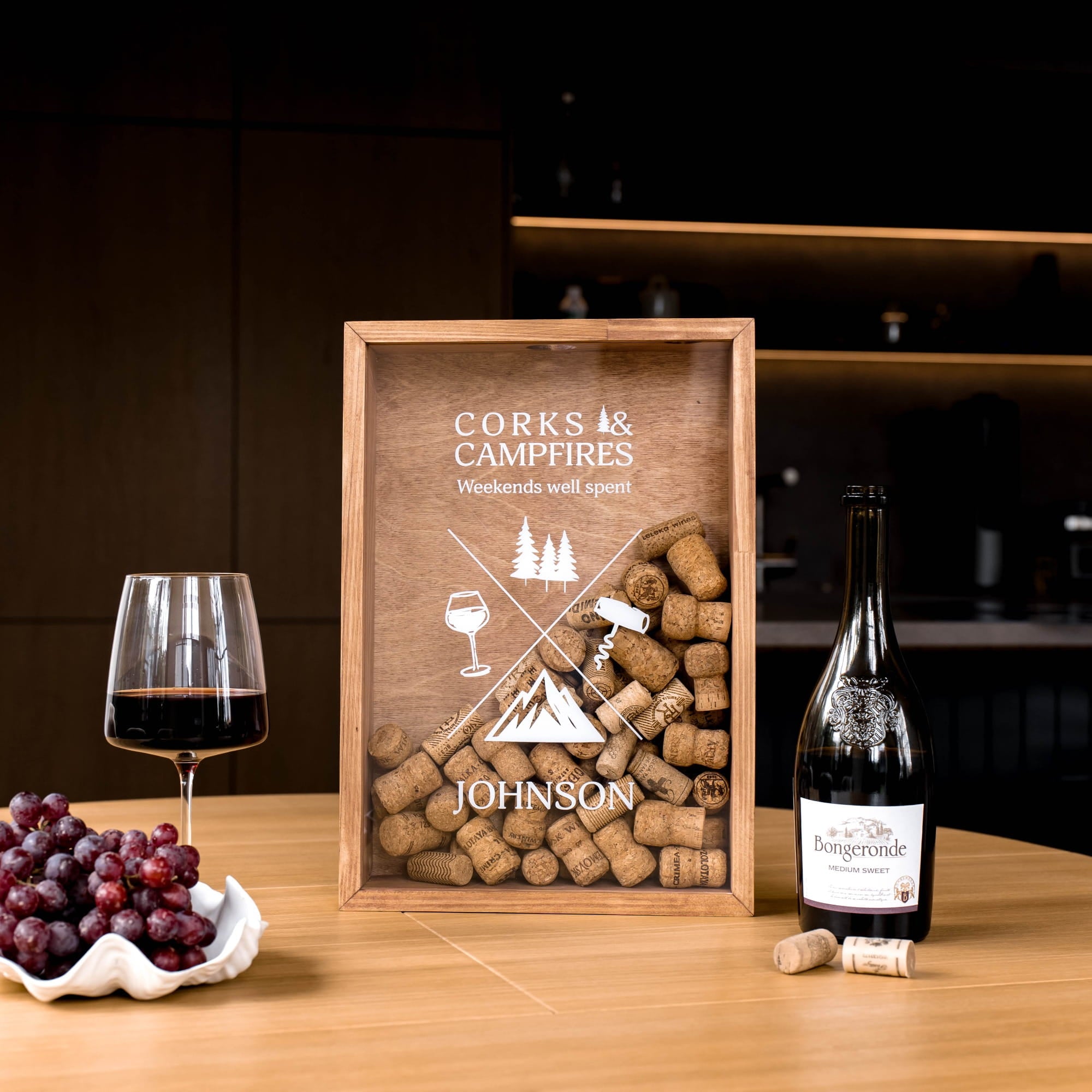 A personalized wooden gift box filled with wine corks