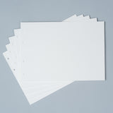 Stack of white paper sheets on a gray background