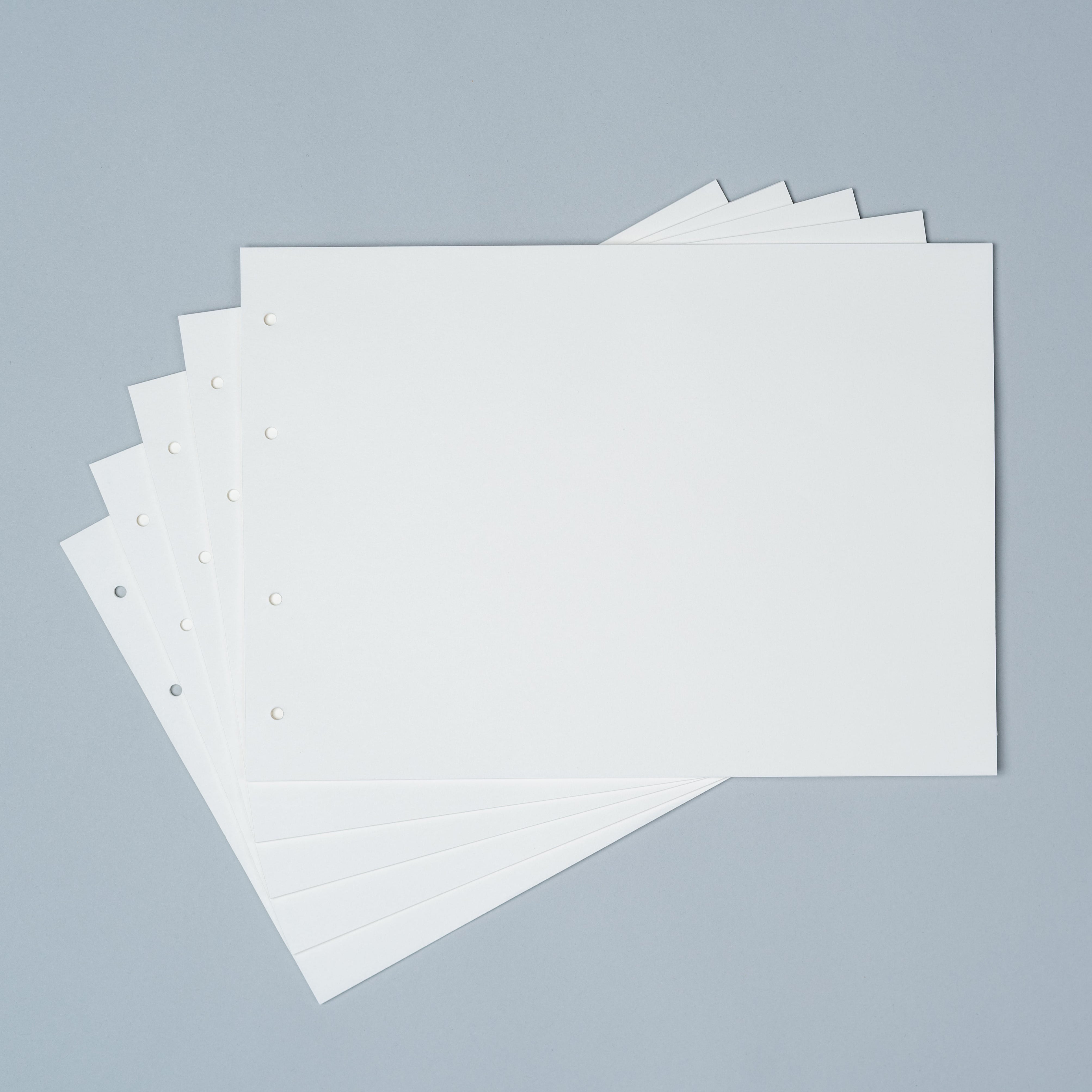 Stack of white paper sheets on a gray background