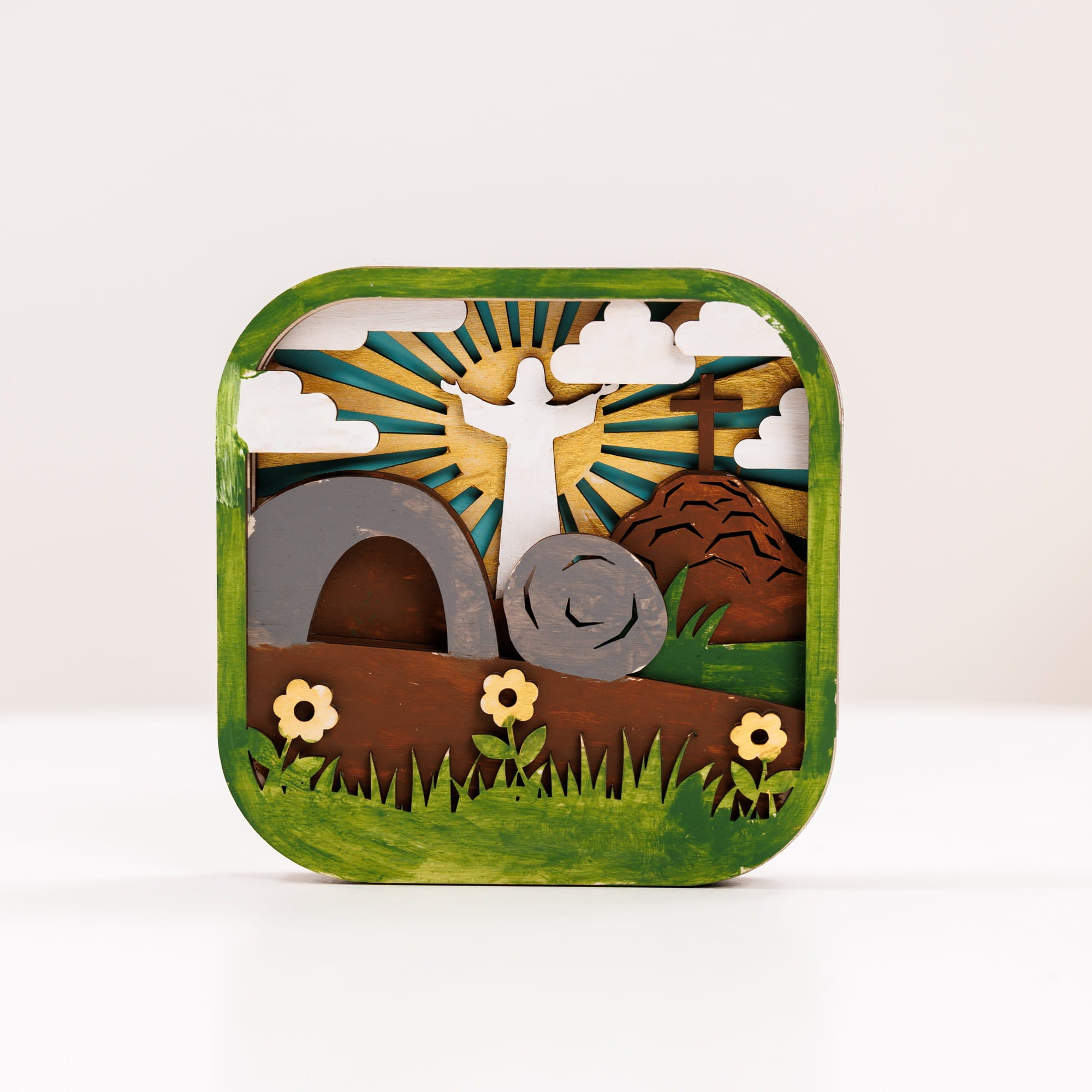 Decorative tin with a design of a snail, sun, and landscape on a white background