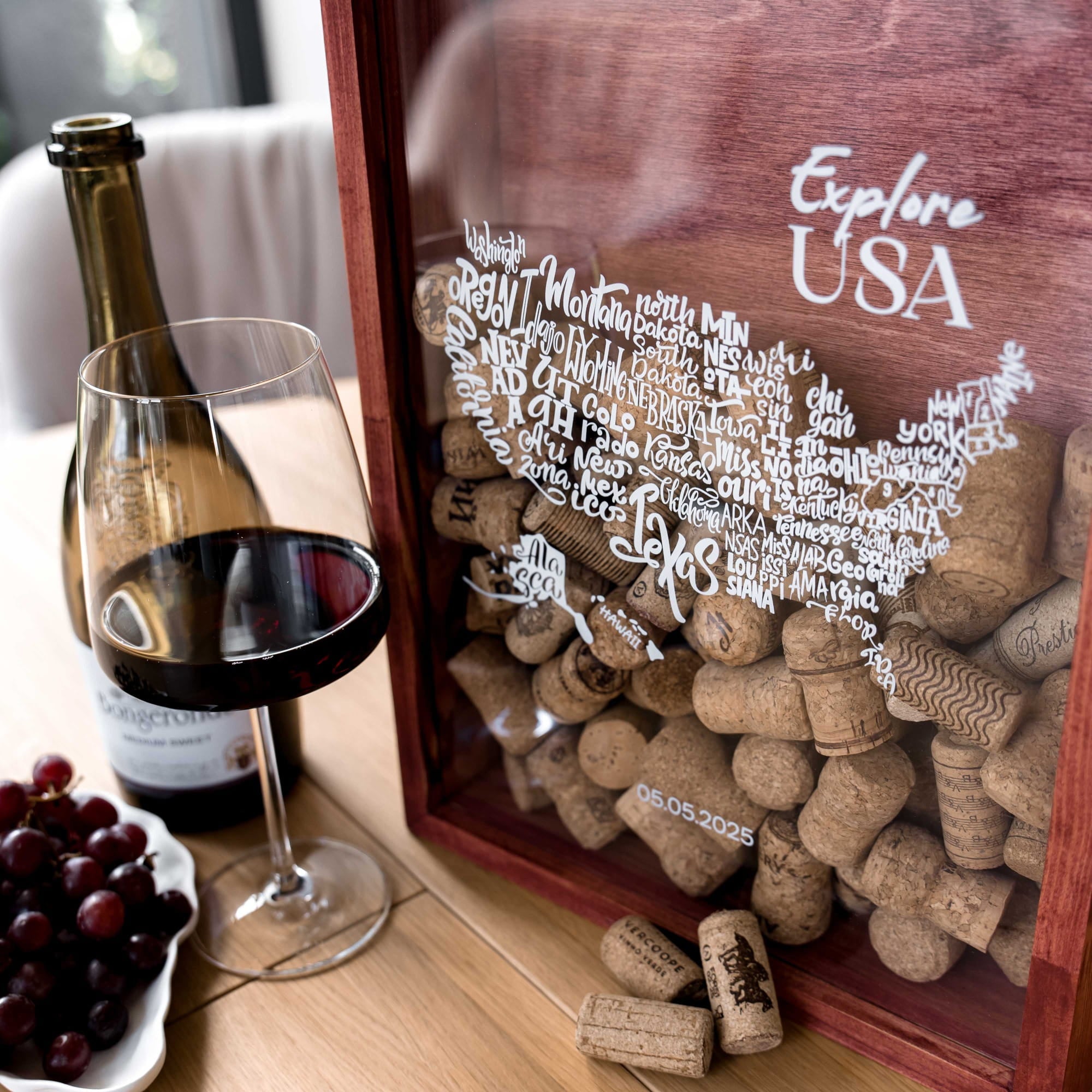 A wooden wine-themed keepsake box filled with corks