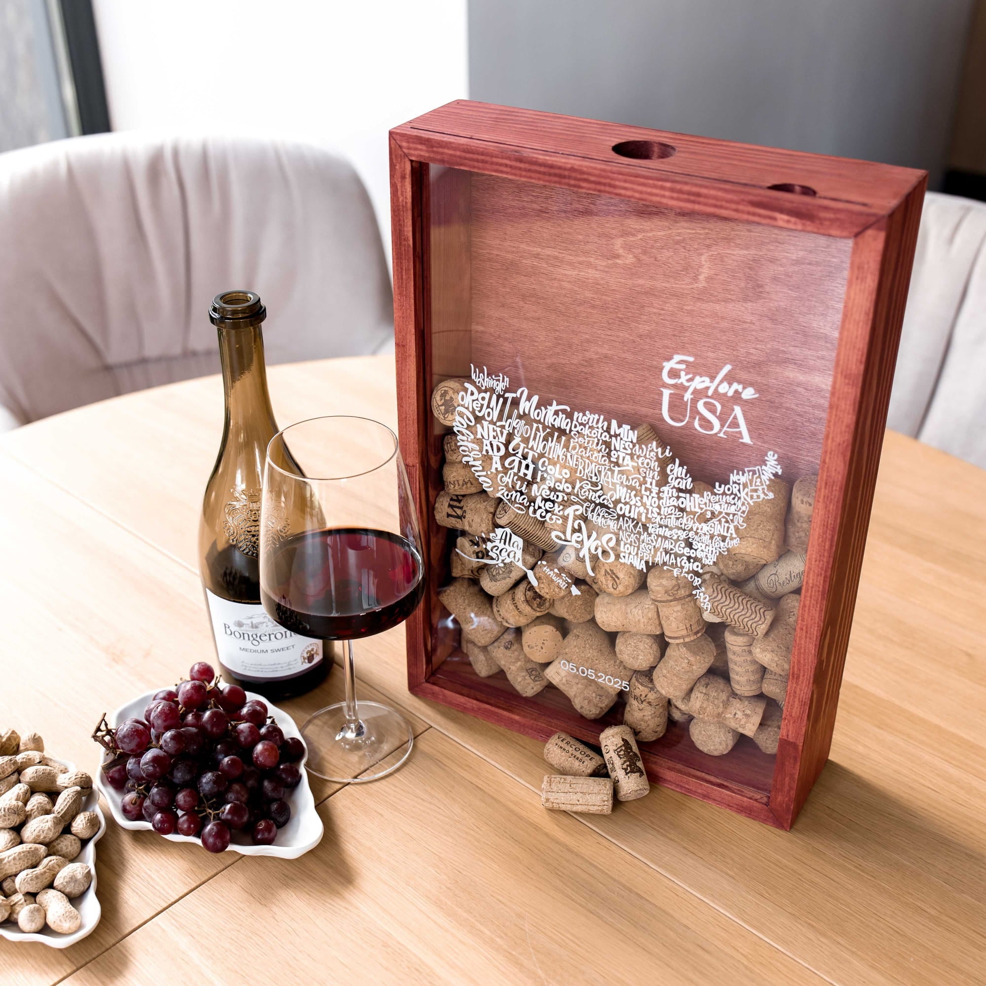 A wooden wine-themed keepsake box filled with corks
