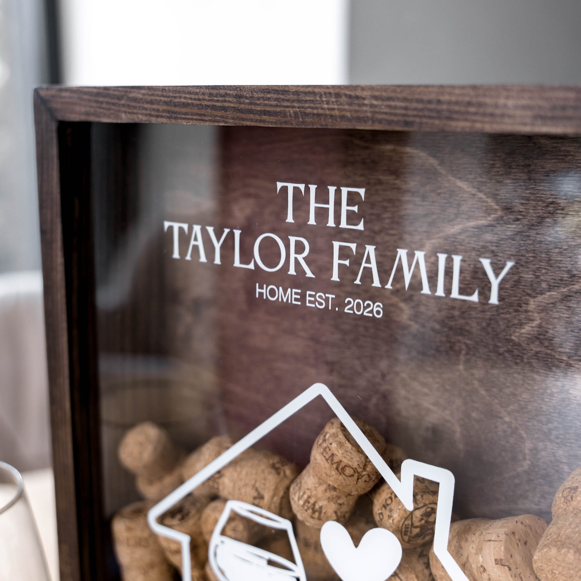 A close-up of a personalized wooden shadow box