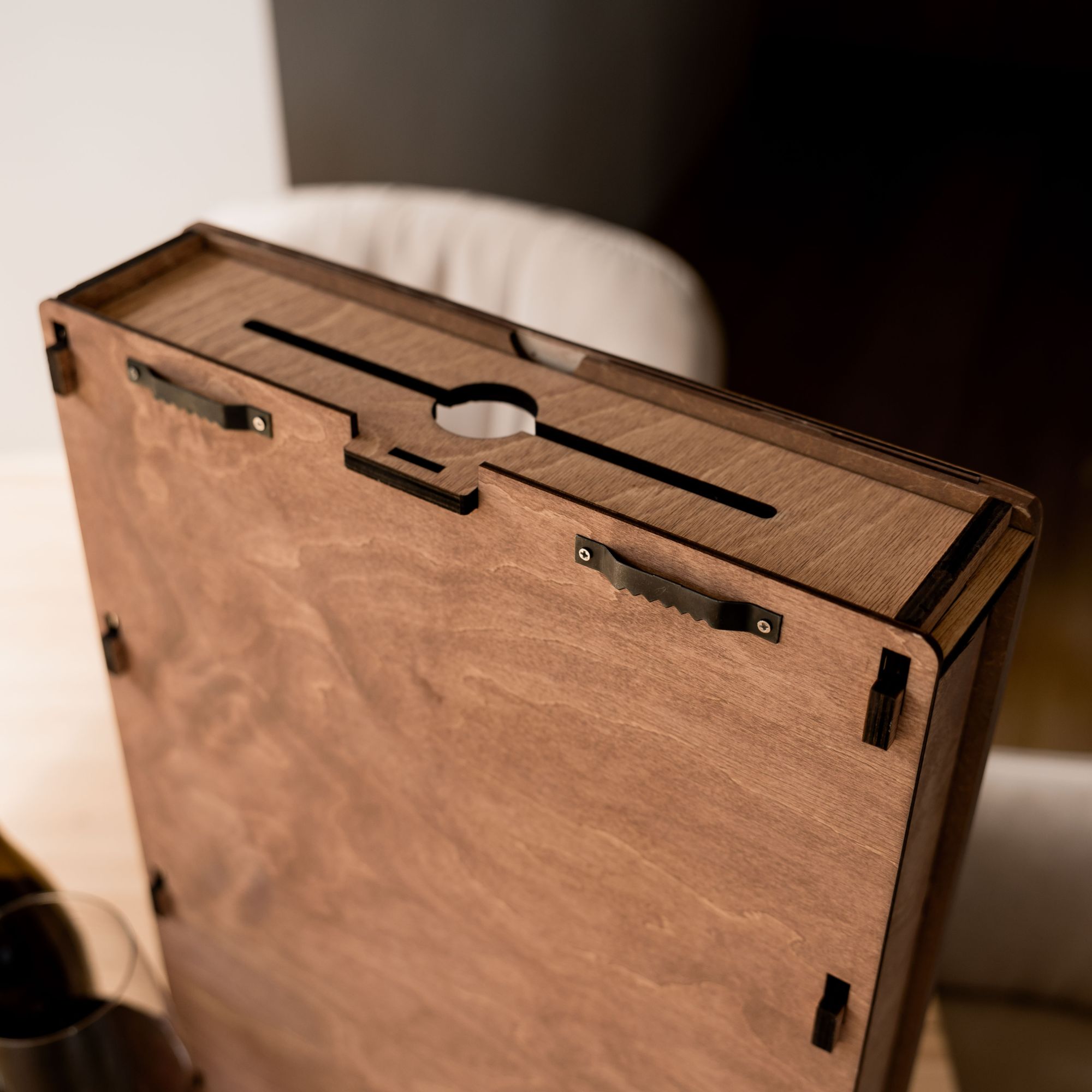 Back side of wooden wine cork storage box with slot for corks