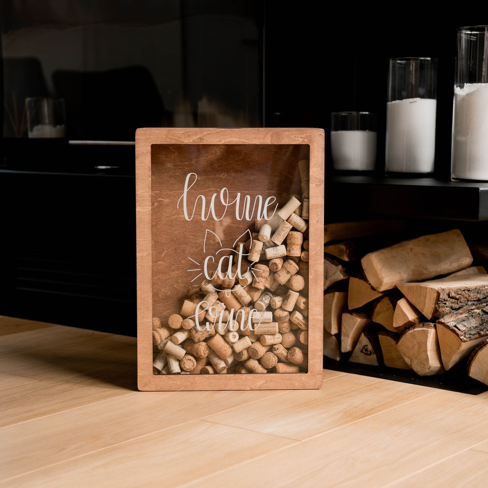 Wooden cork collector box with inscription Home Cat Wine near fireplace