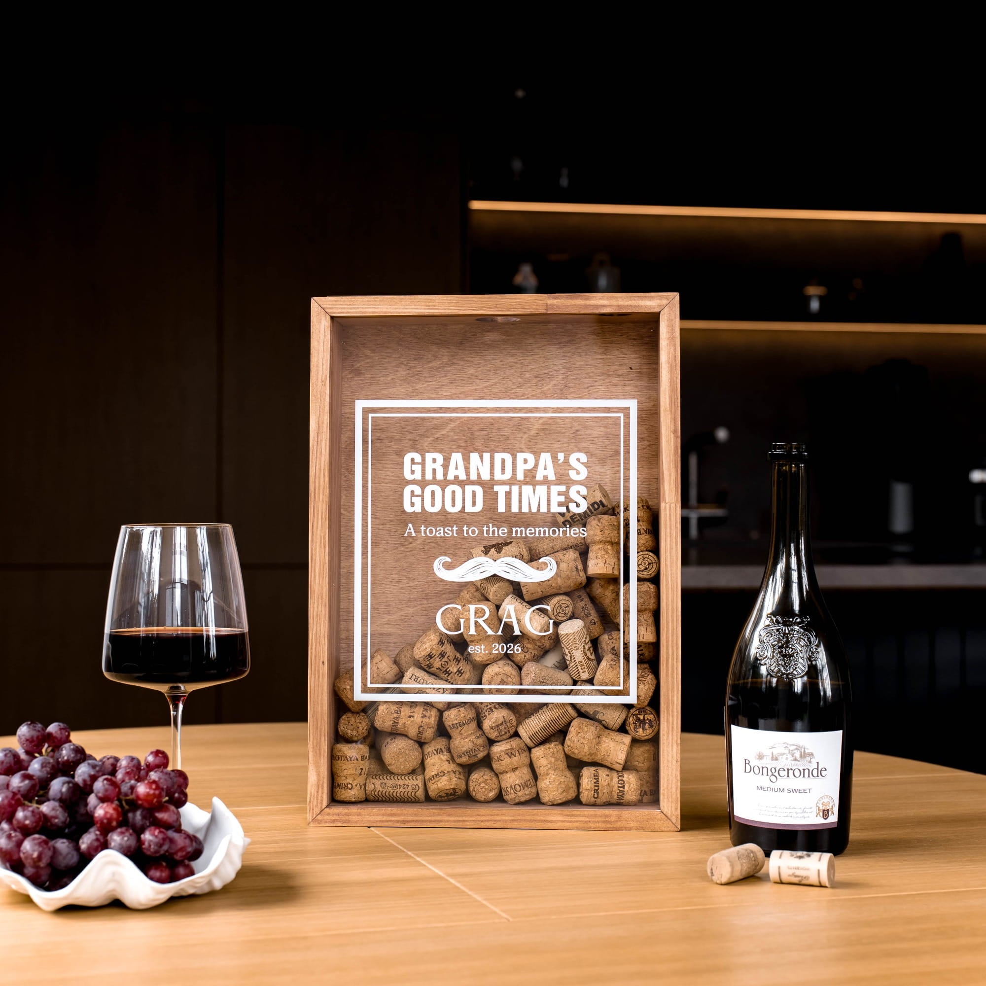 A wooden gift box filled with wine corks sits on a wooden table