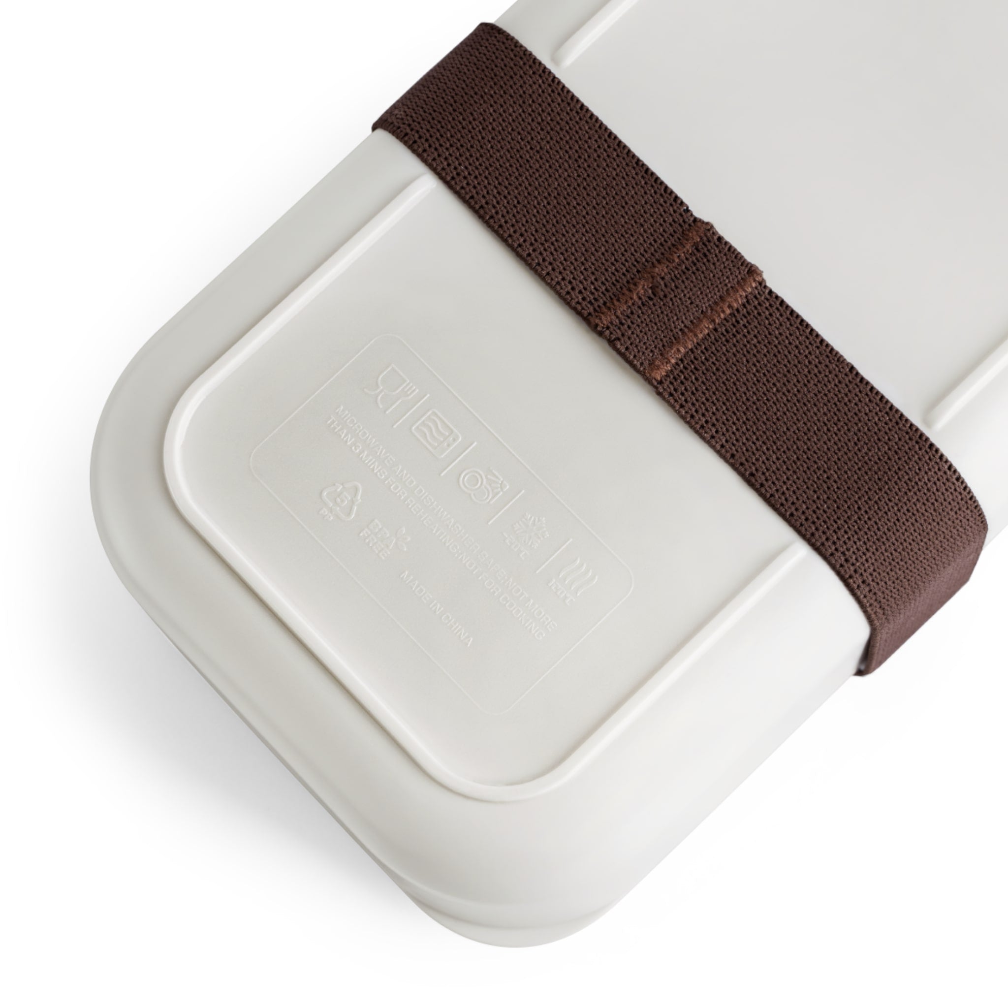 White lunch box with a brown strap on a white background