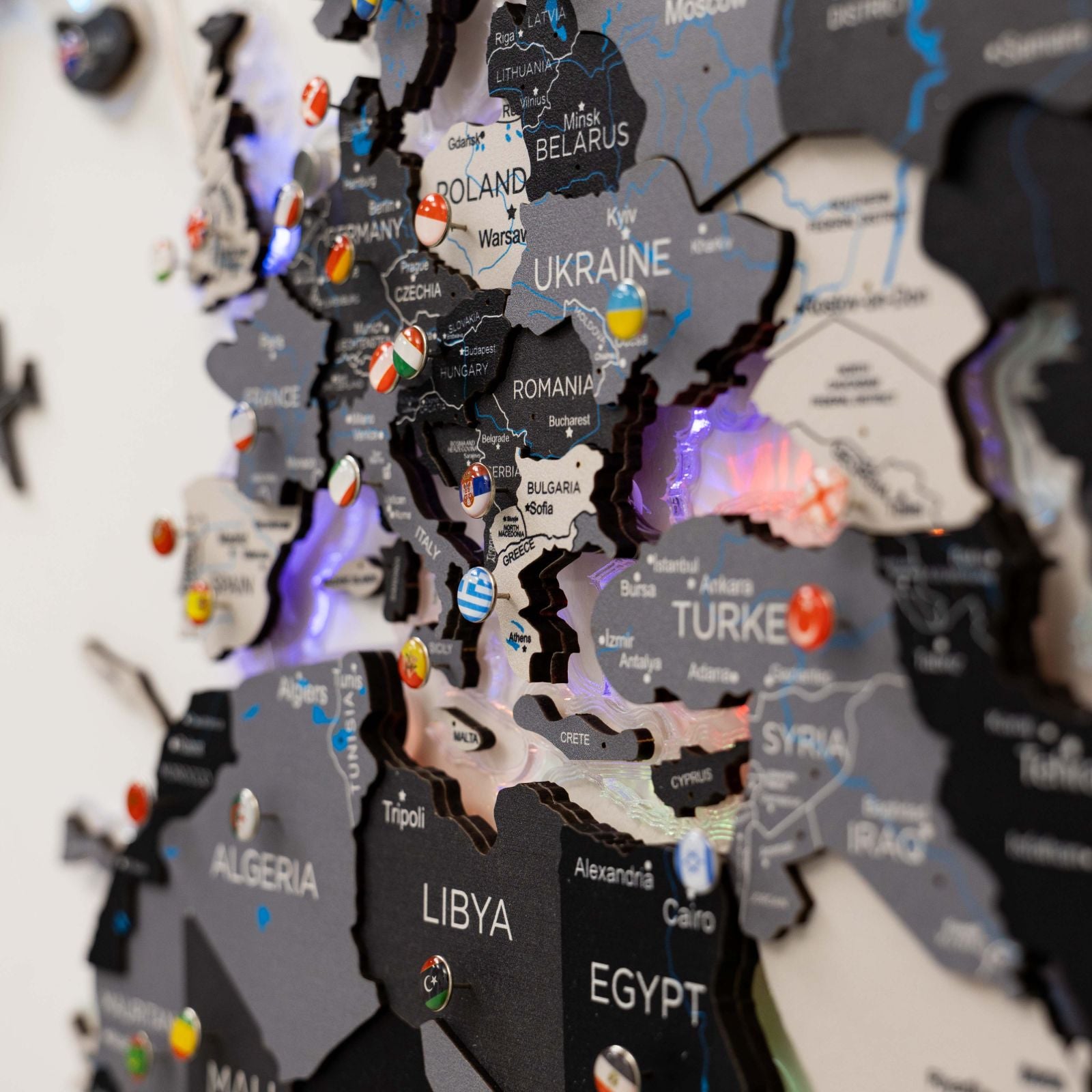 Map of Europe with country names and flags on a black background