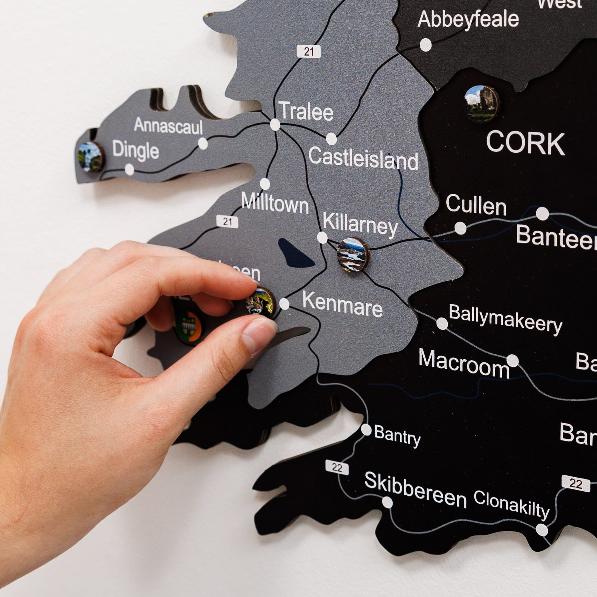 Map of Ireland with a hand placing a location marker on Cork.