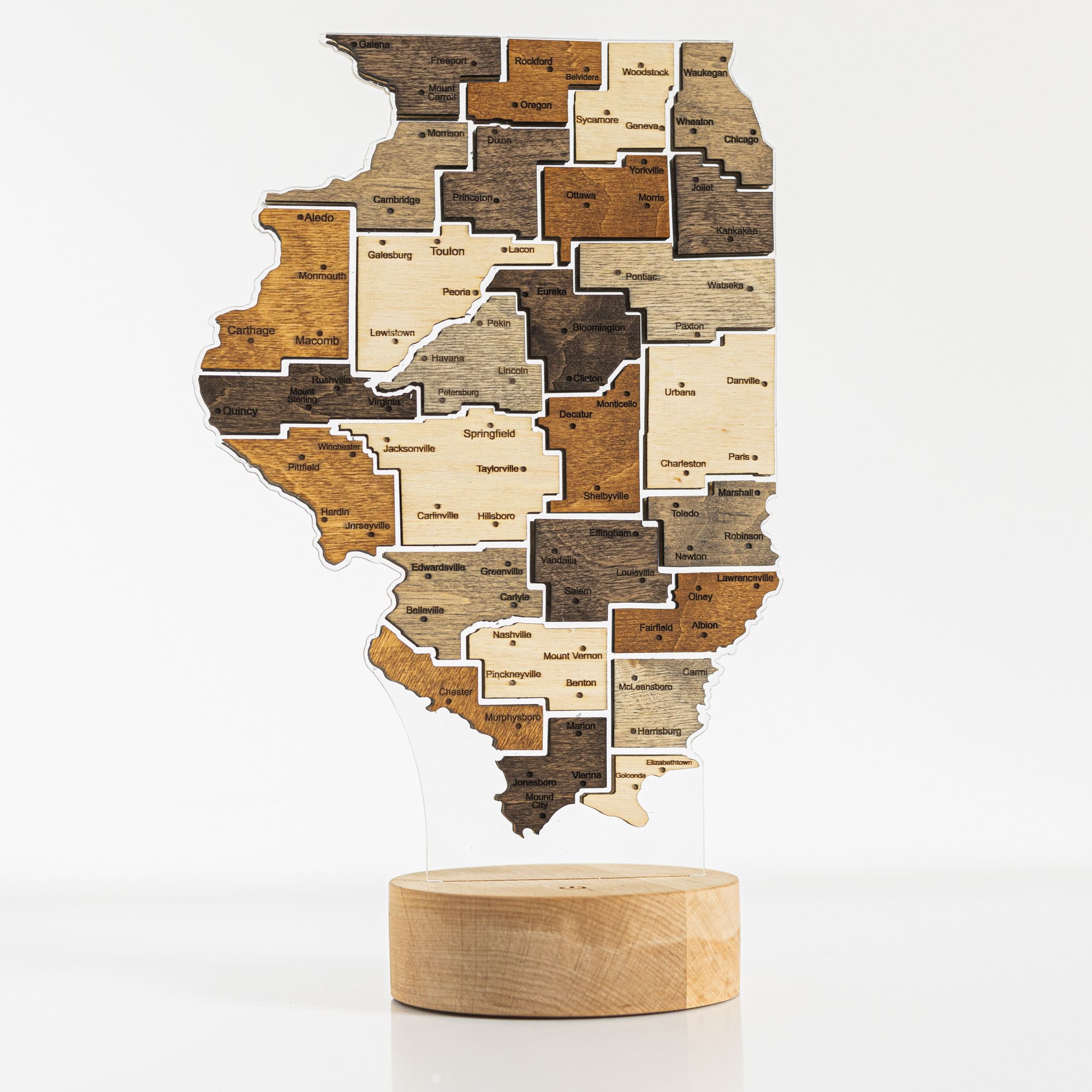 Wooden map of Illinois on a white background