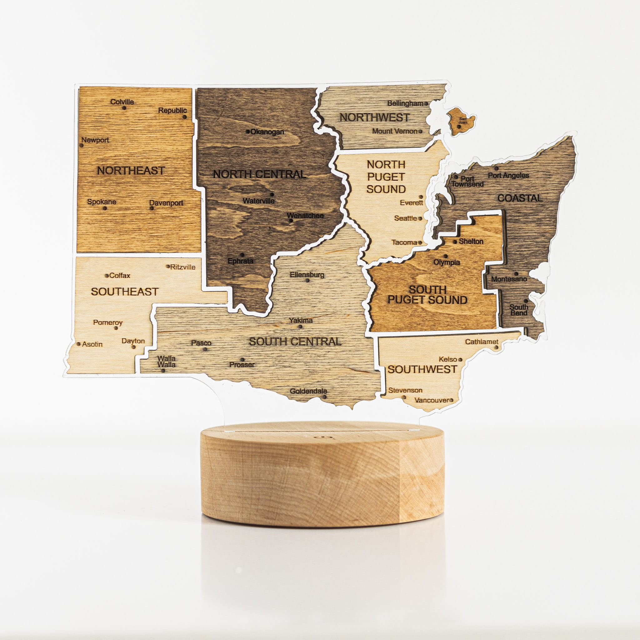 Wooden map of Washington state on a white background