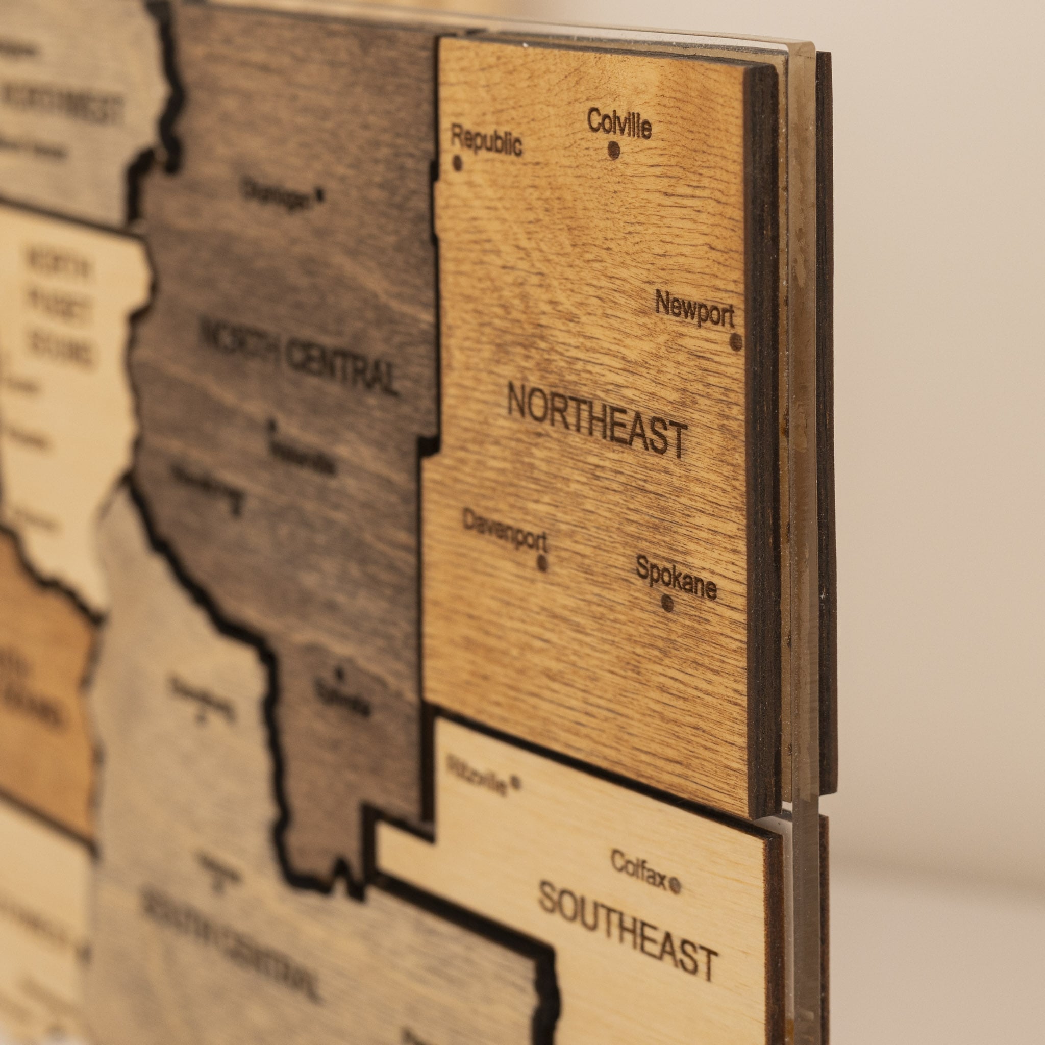Wooden map of the United States with labeled regions