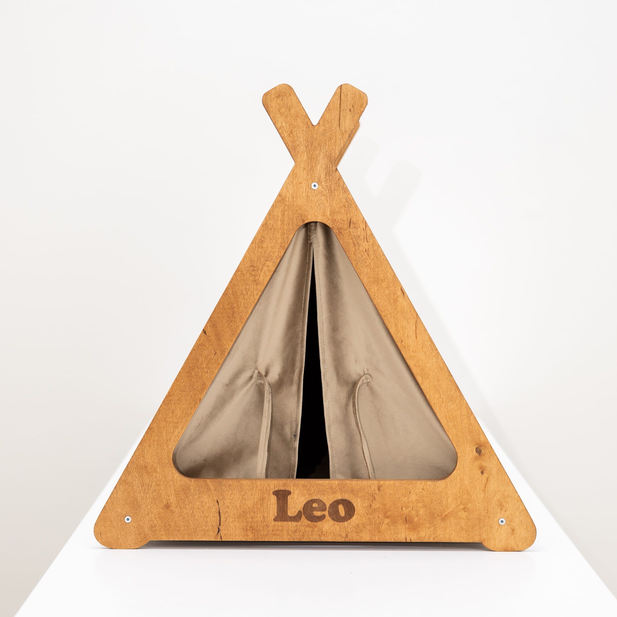 Wooden teepee-shaped pet bed with 'Leo' on a white background
