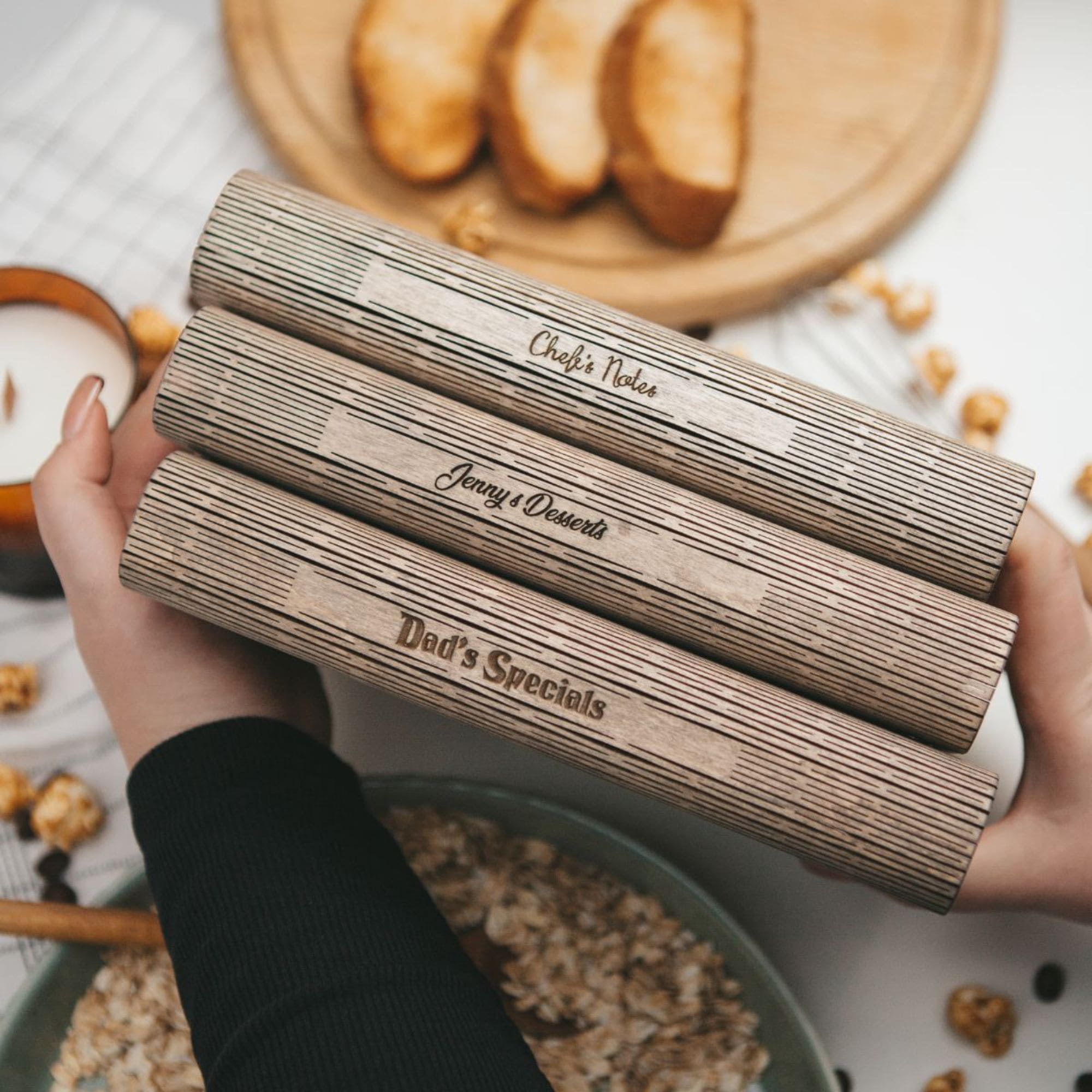 Wooden recipe organizer with kitchen tools and fresh bread