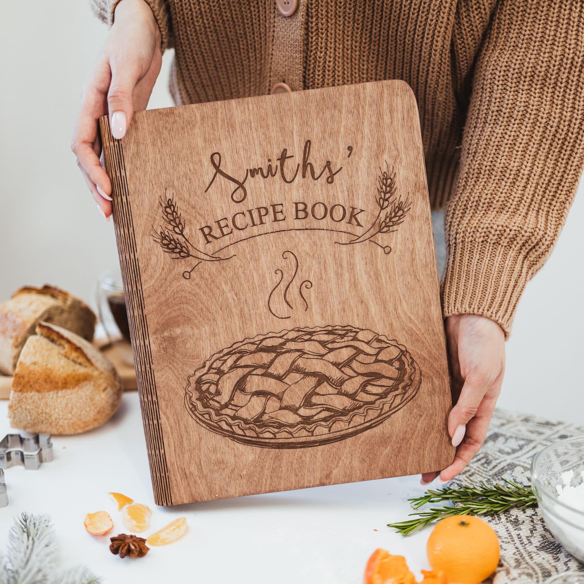 Personalized wooden recipe book with engraved pie design on cover