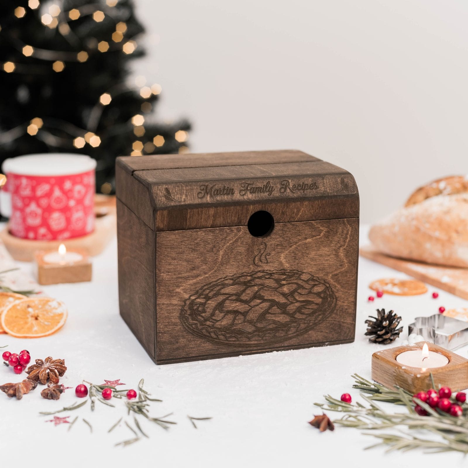 Dark recipe box with Family Recipes engraving on holiday background.