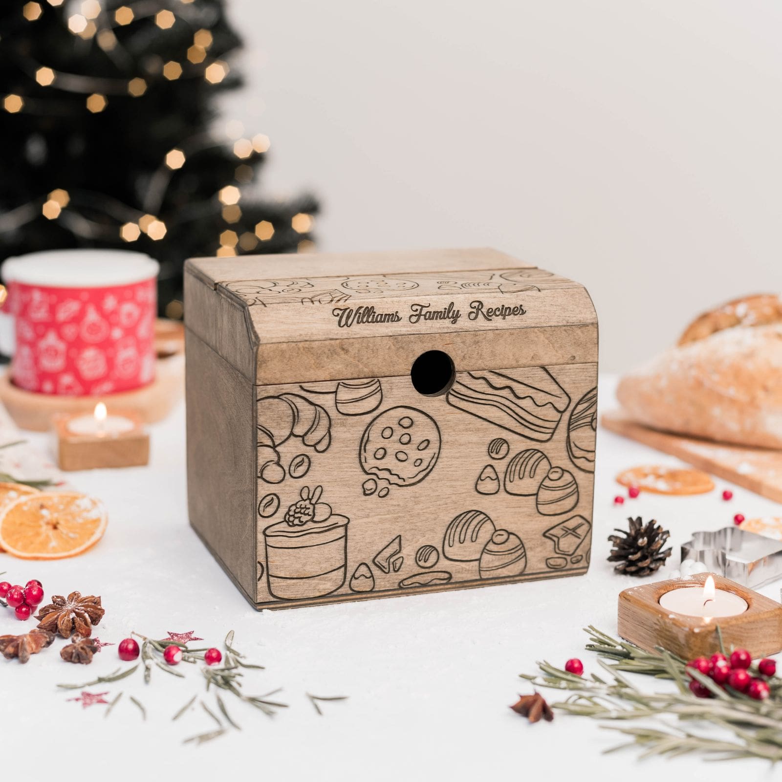 Custom engraved wooden recipe box on Christmas table with lights and decorations