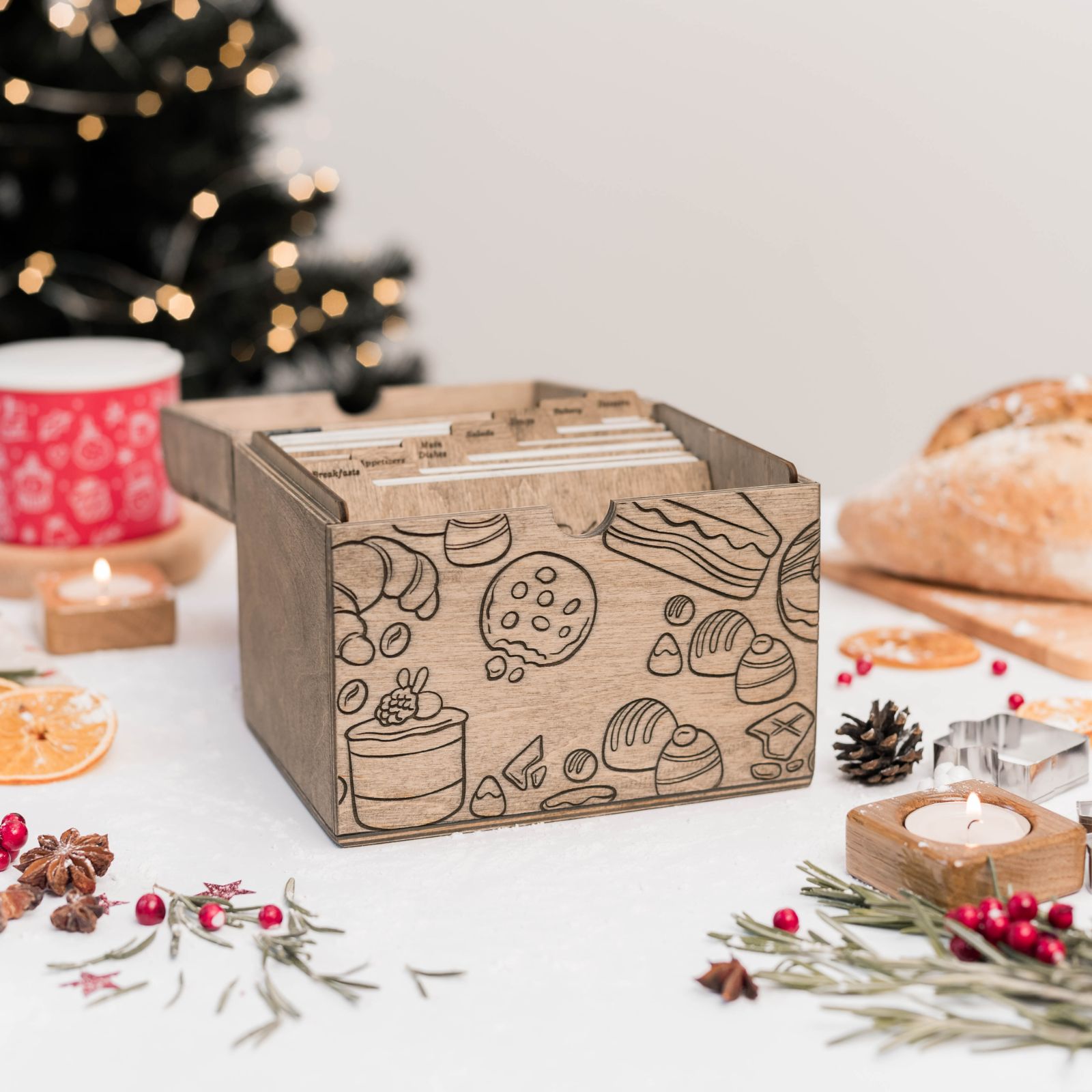 Open personalized wooden recipe box with recipe cards inside and festive holiday background