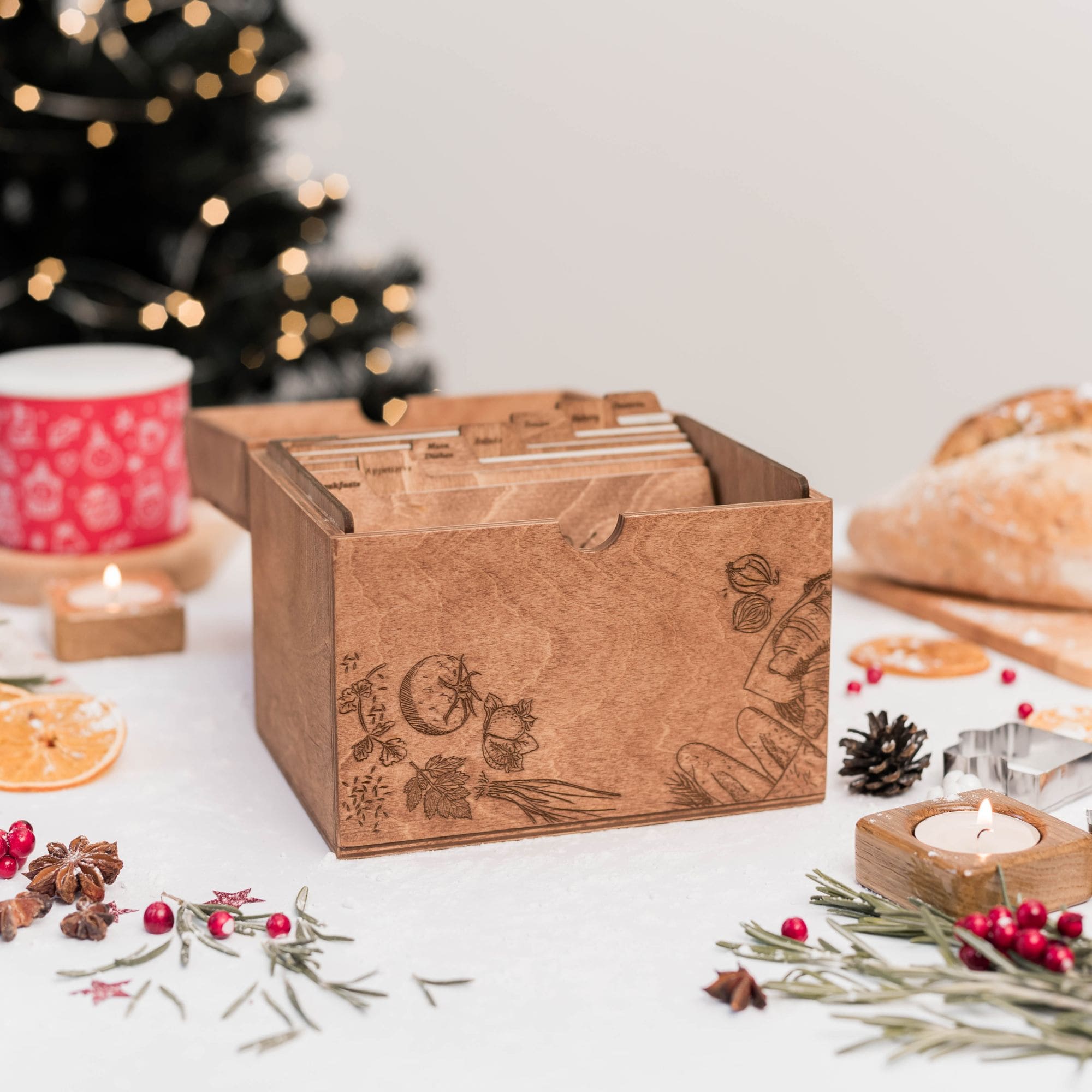 Wooden recipe box with engraved vegetables on Christmas table with festive decor