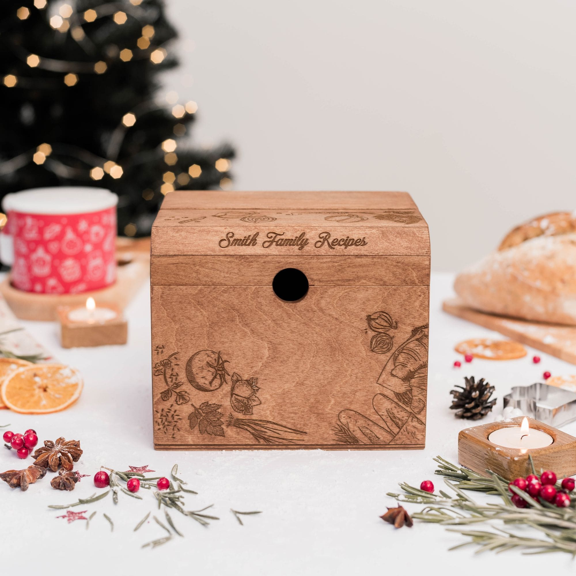 Closed personalized wooden recipe box with engraved vegetables and family name on lid