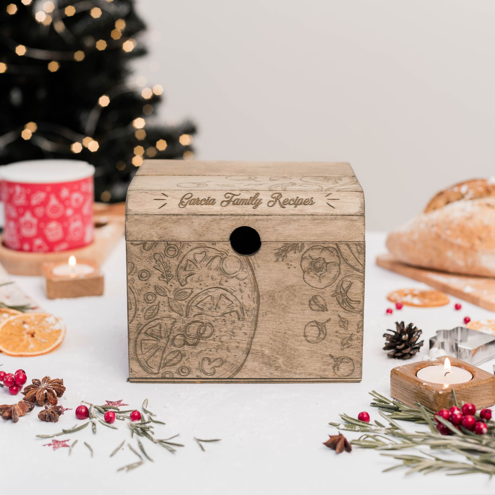 Rustic wooden recipe box with engraved pattern and recipe cards
