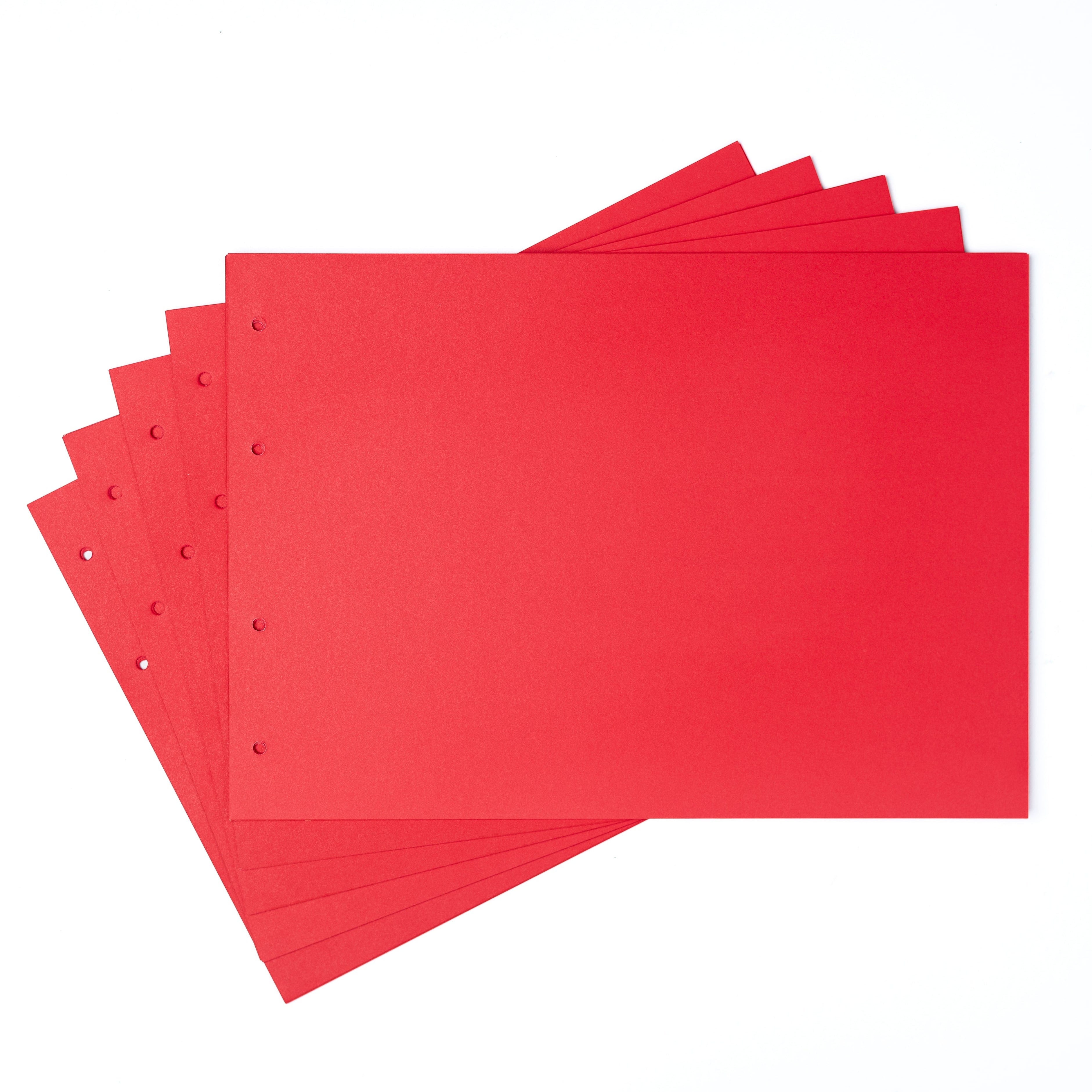 Red paper sheets with holes on a white background