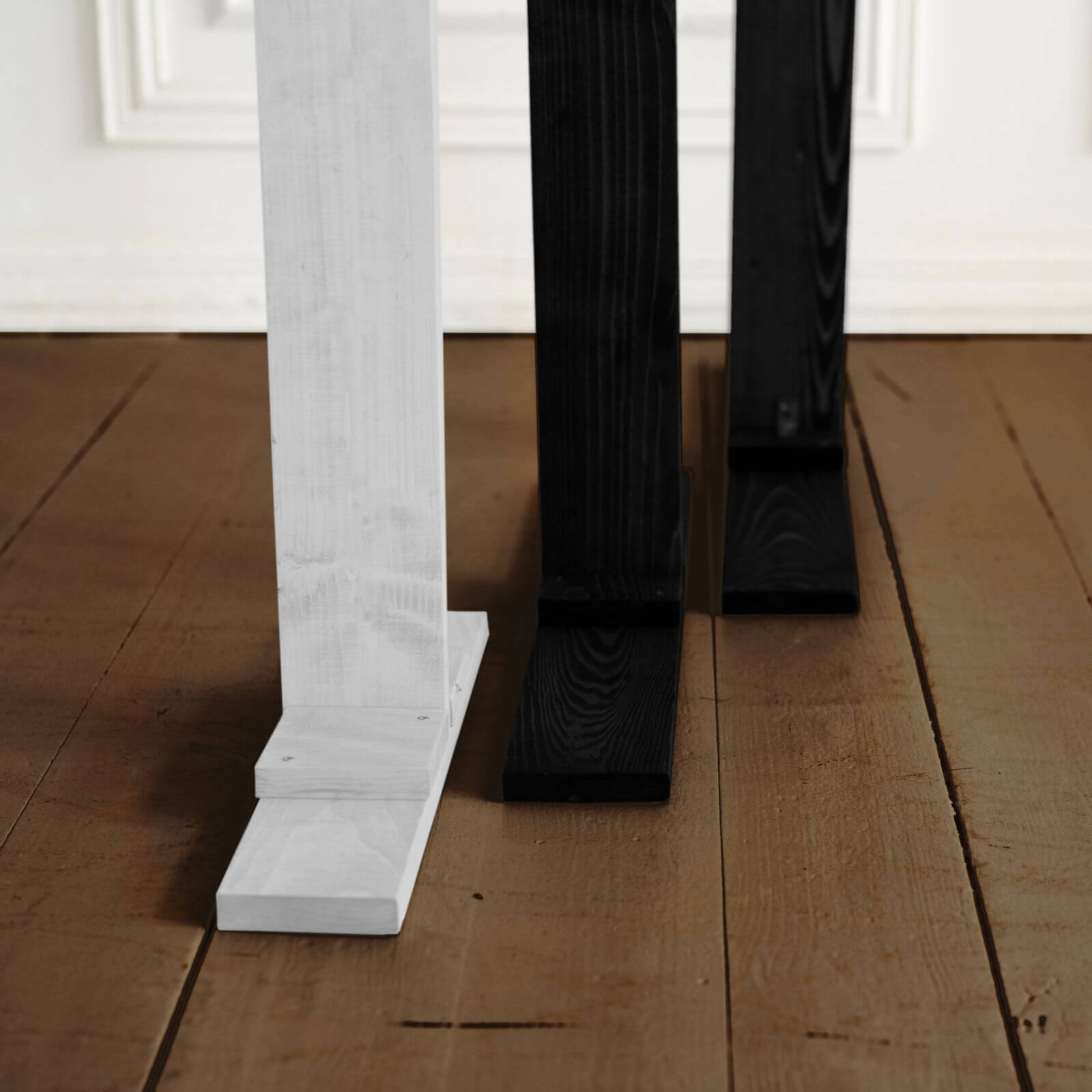 Close-up of sturdy wooden bases supporting triangle arches.