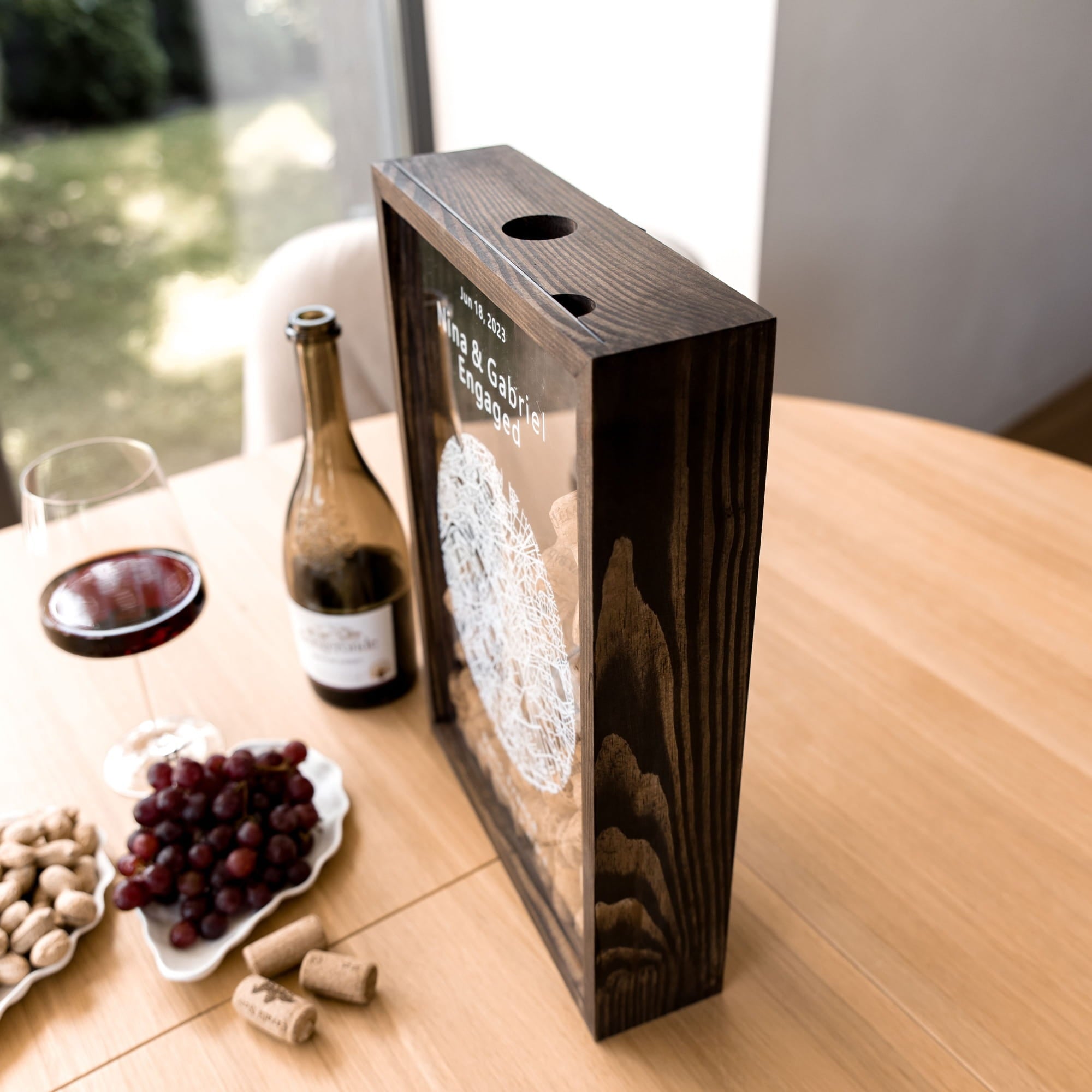 A dark wood wine box with a circular white graphic and the text 'Wine & Co.