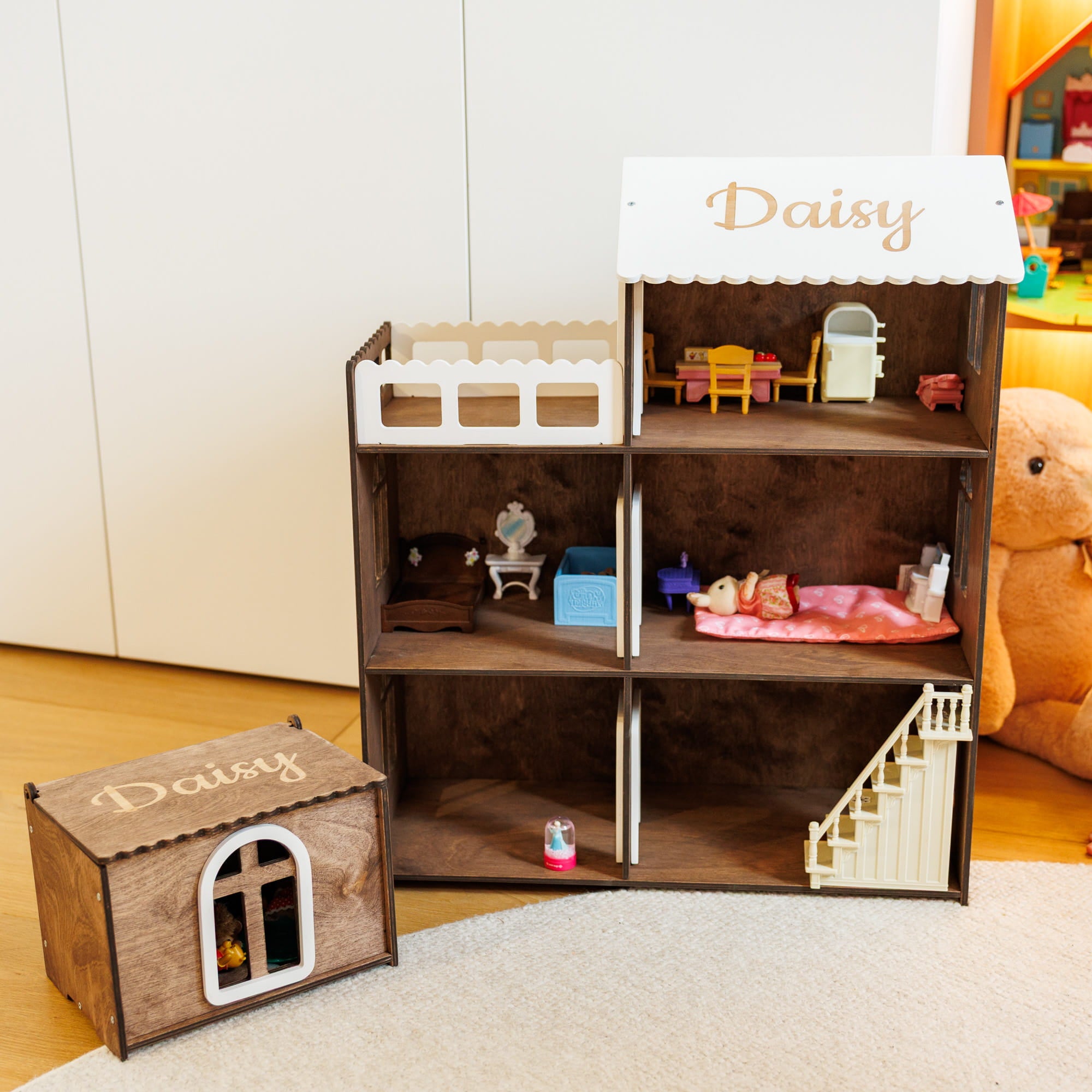 wooden dollhouse set with a multi-story house