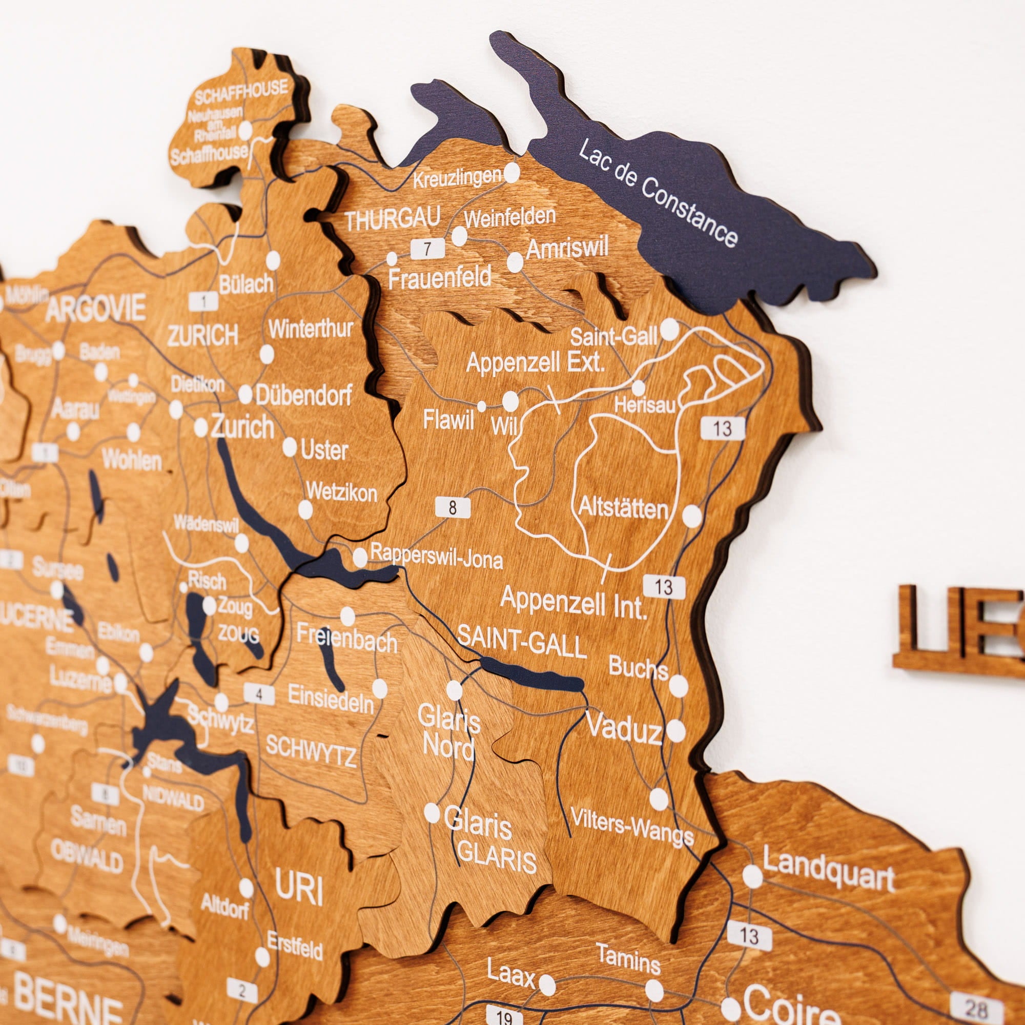 Wooden puzzle map of Switzerland with regions labeled