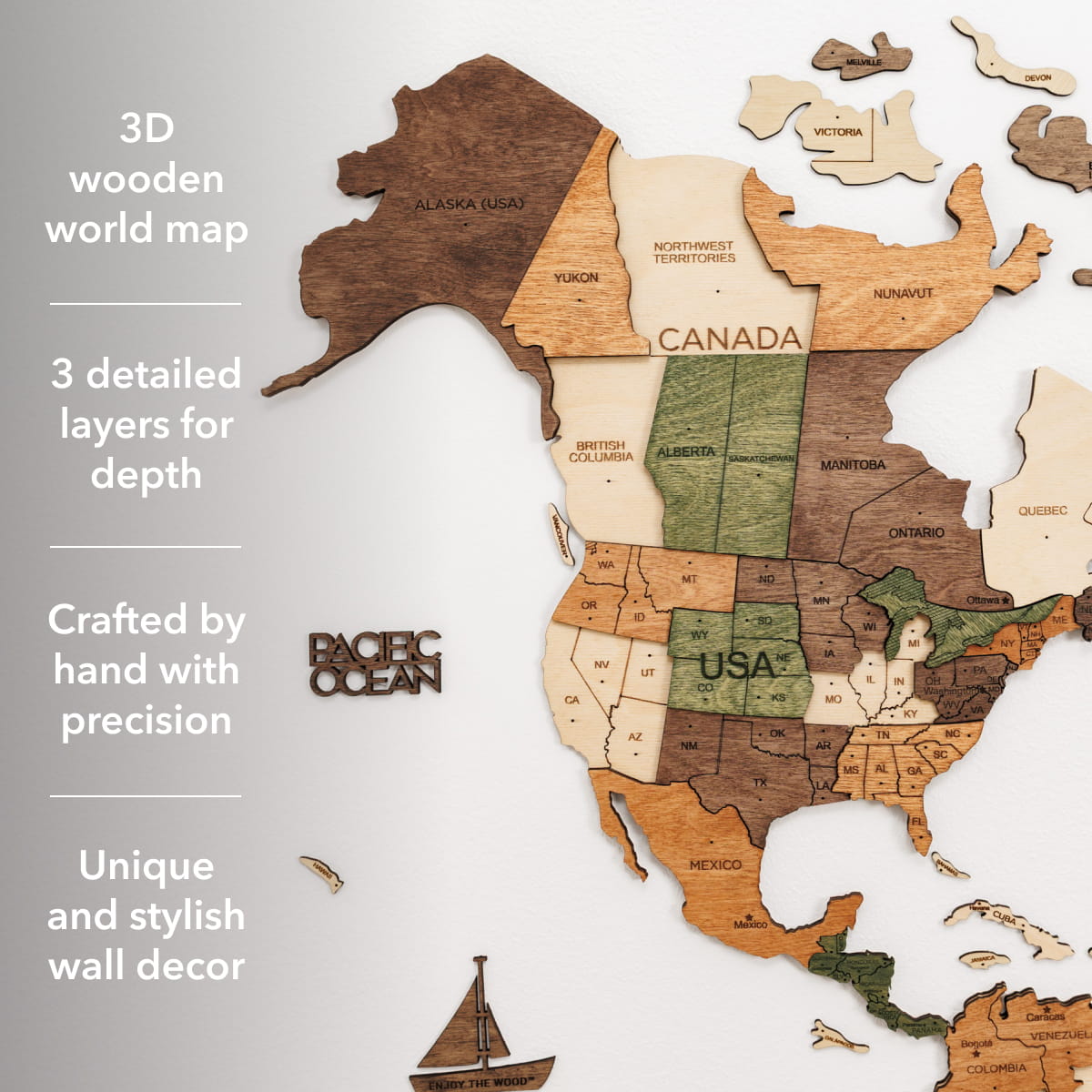A wooden world map wall decor set showing North and South America with labeled countries and states. The map is made from multiple natural wood tones and includes small floating continents, a sailboat piece, and text callouts on the left describing 3D wooden world map features.