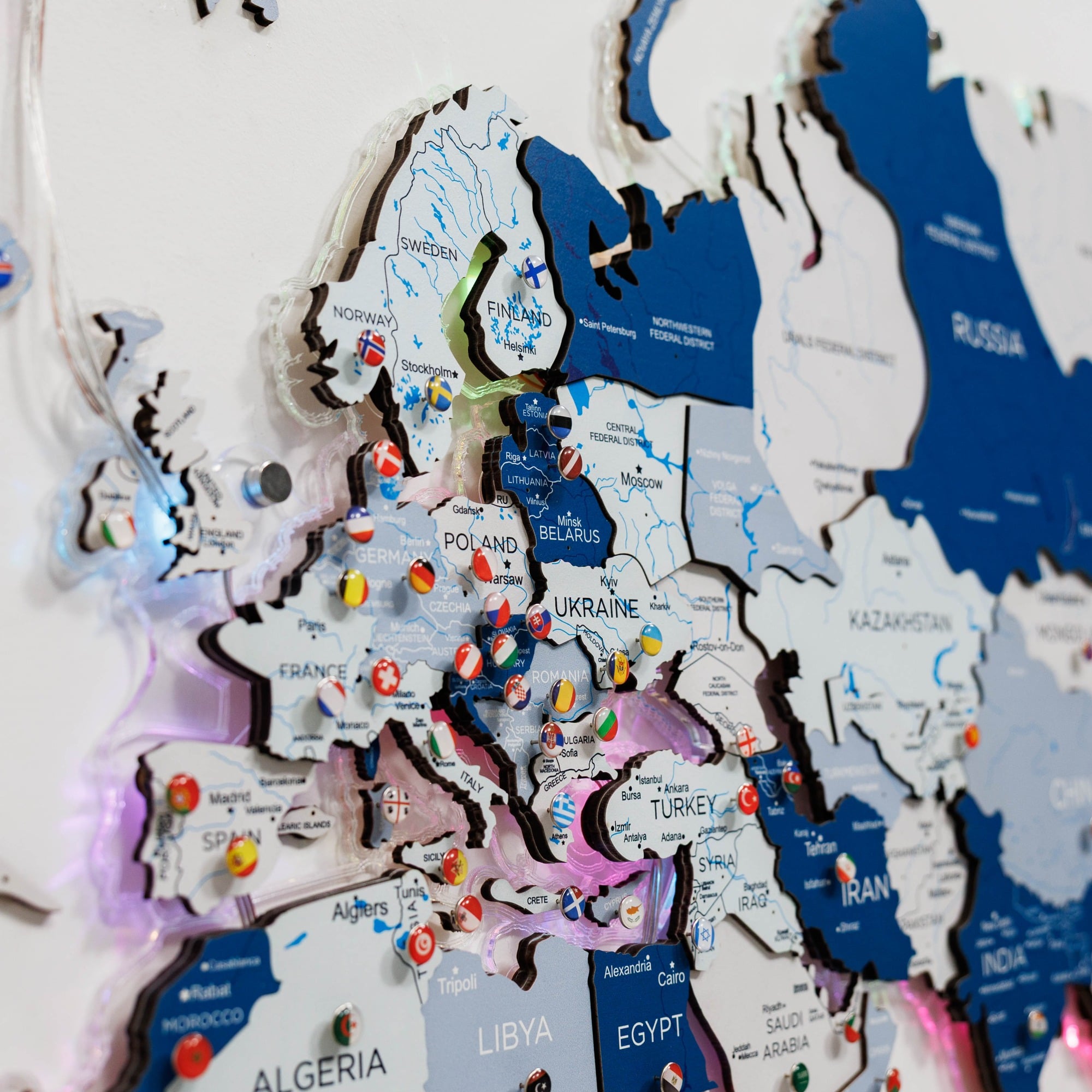 World map with colorful pins on a white background