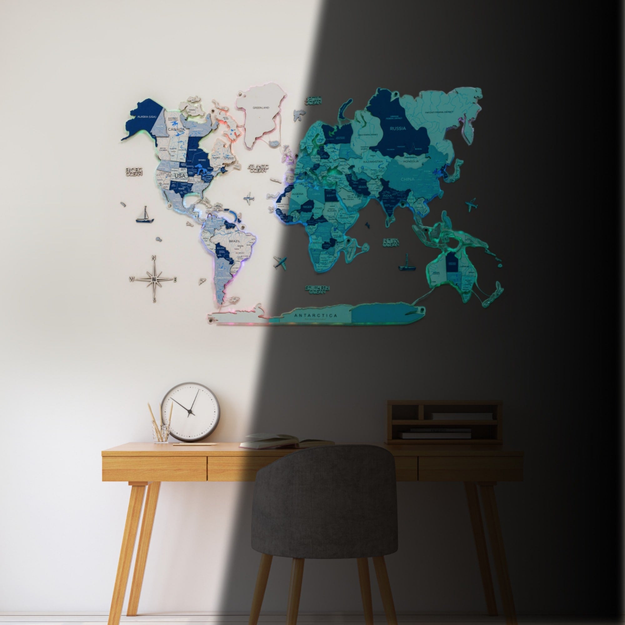 World map on a wall with a desk and chair in the foreground