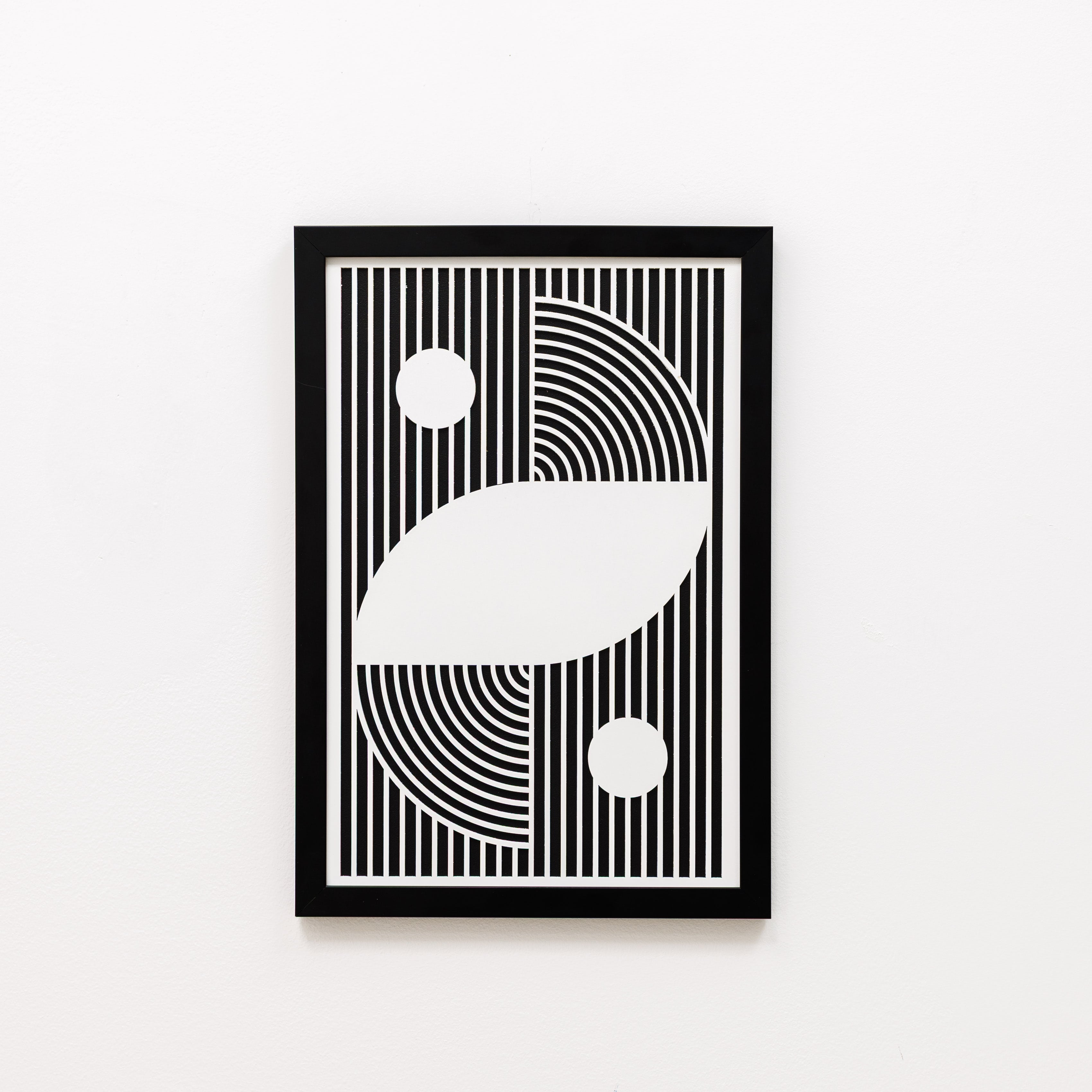 Framed black and white geometric art print on a white background
