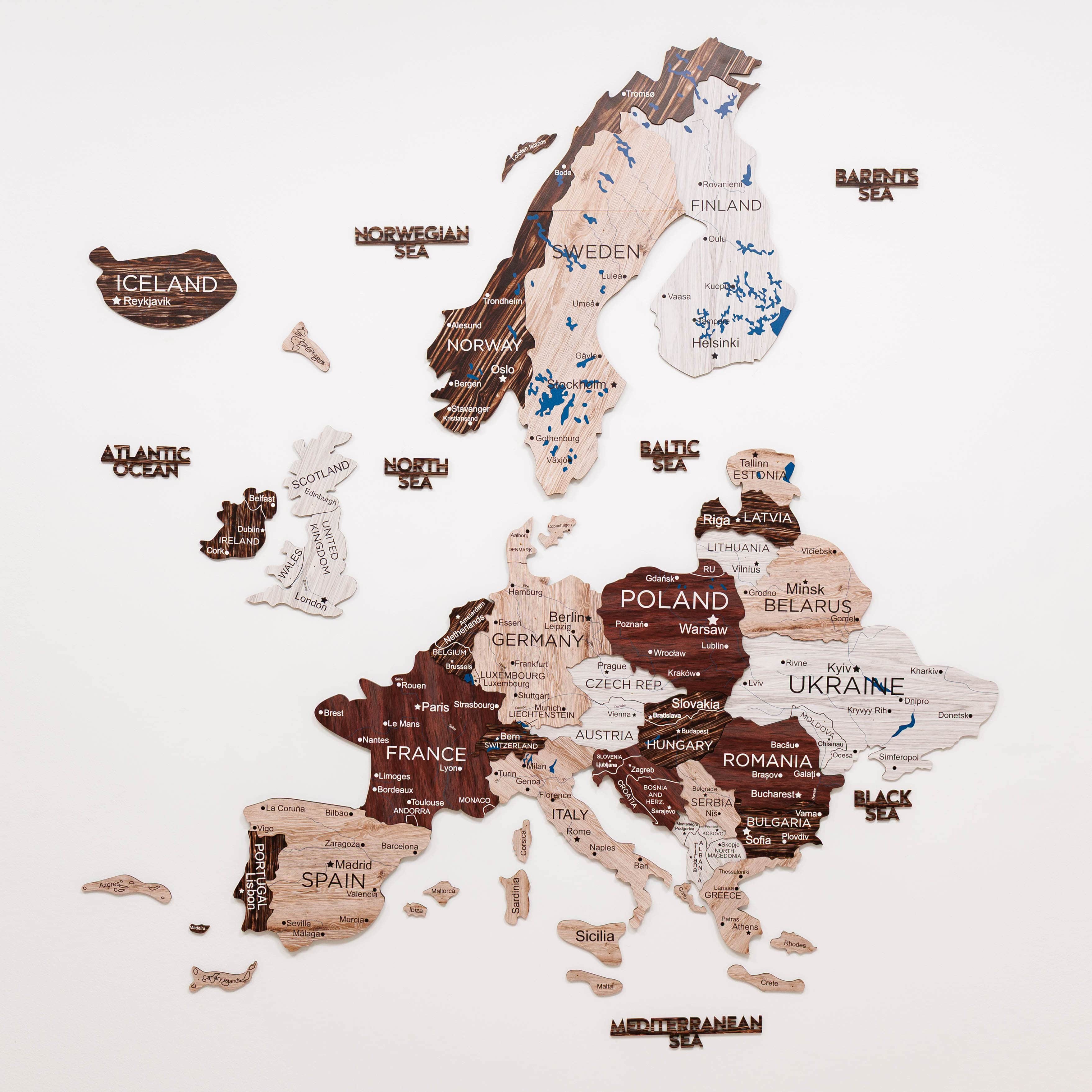 Wooden puzzle map of Europe with countries labeled on a white background