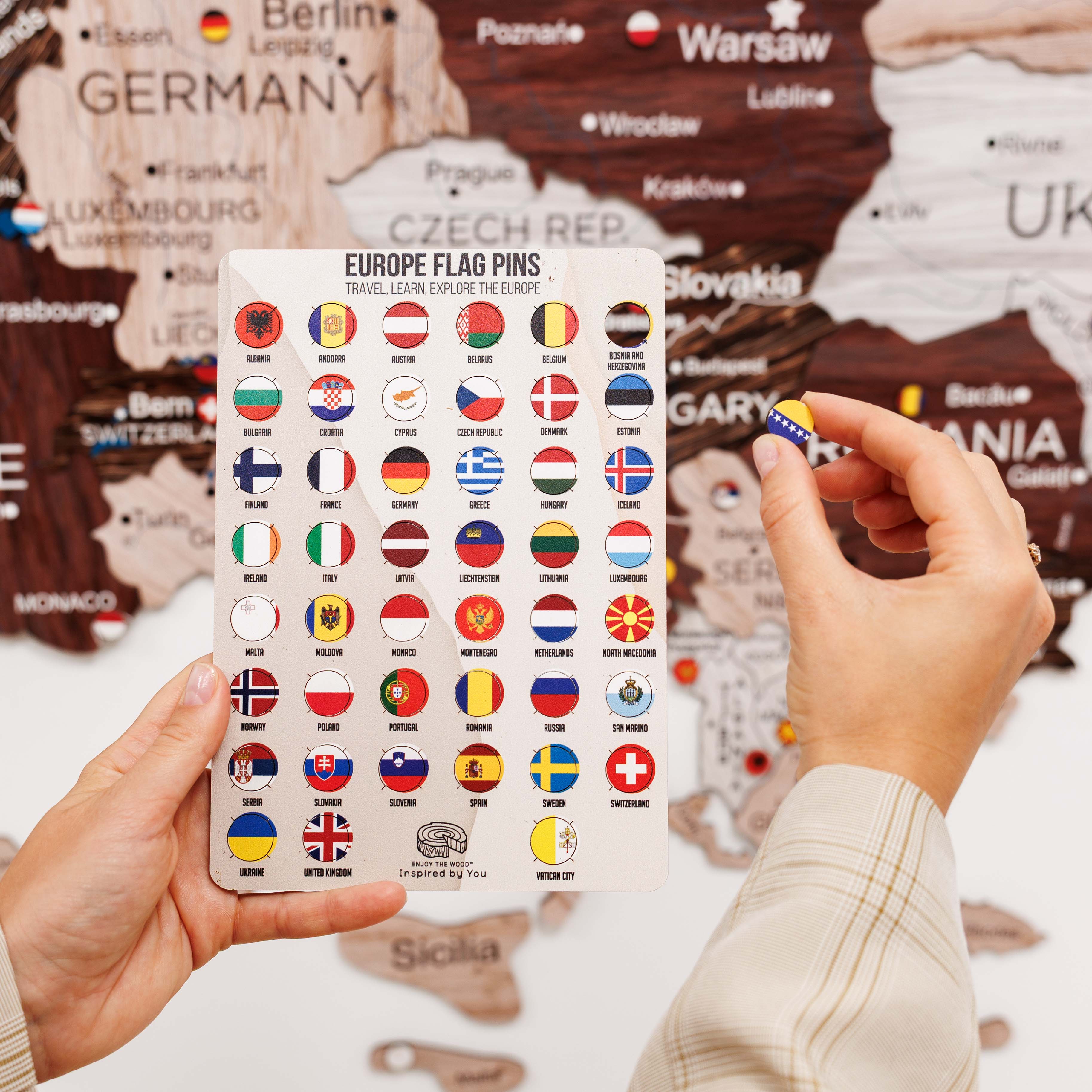 Europe flag pins with a map of Europe in the background