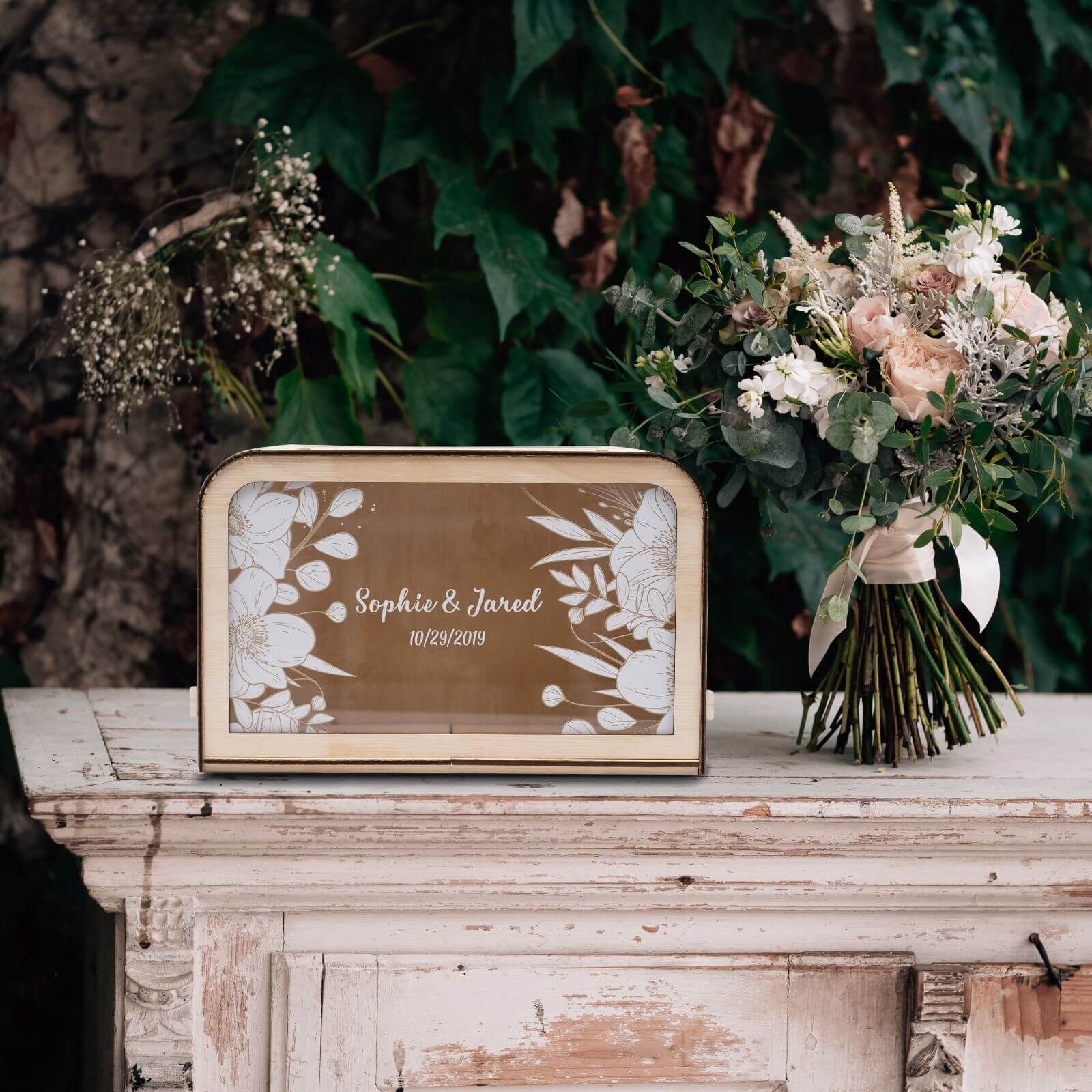 A wooden wedding card box with floral patterns and personalized text 'Sophie & Jared 17.05.