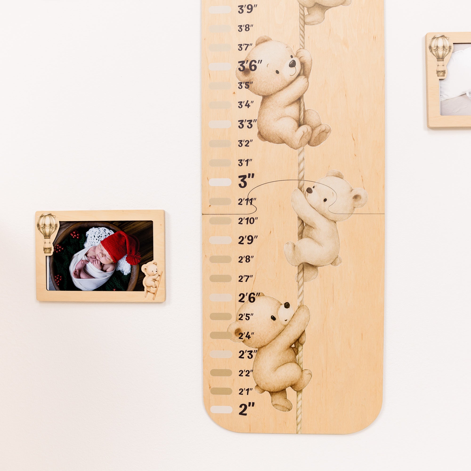 Wooden height chart with teddy bear figures and a photo frame on a white background