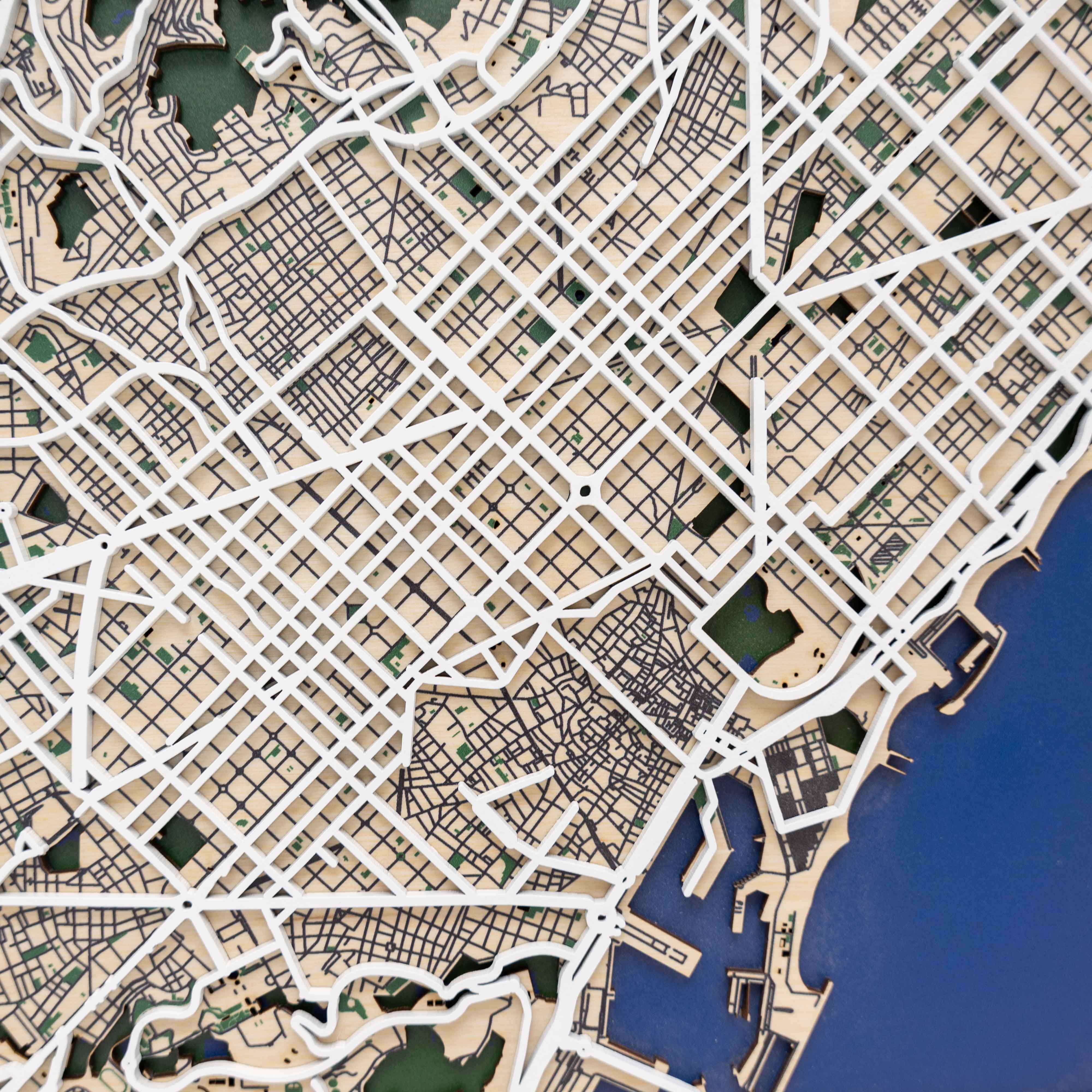 Top-down view of a city street map with grid layout and water body.