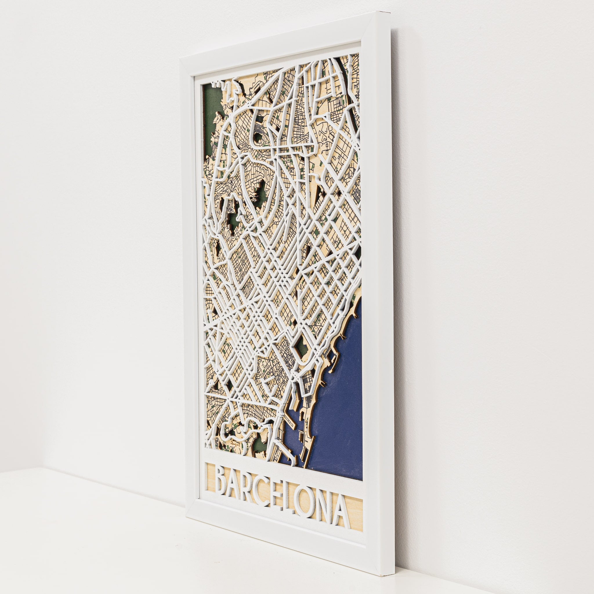 Framed 3D map of Barcelona on a white wall