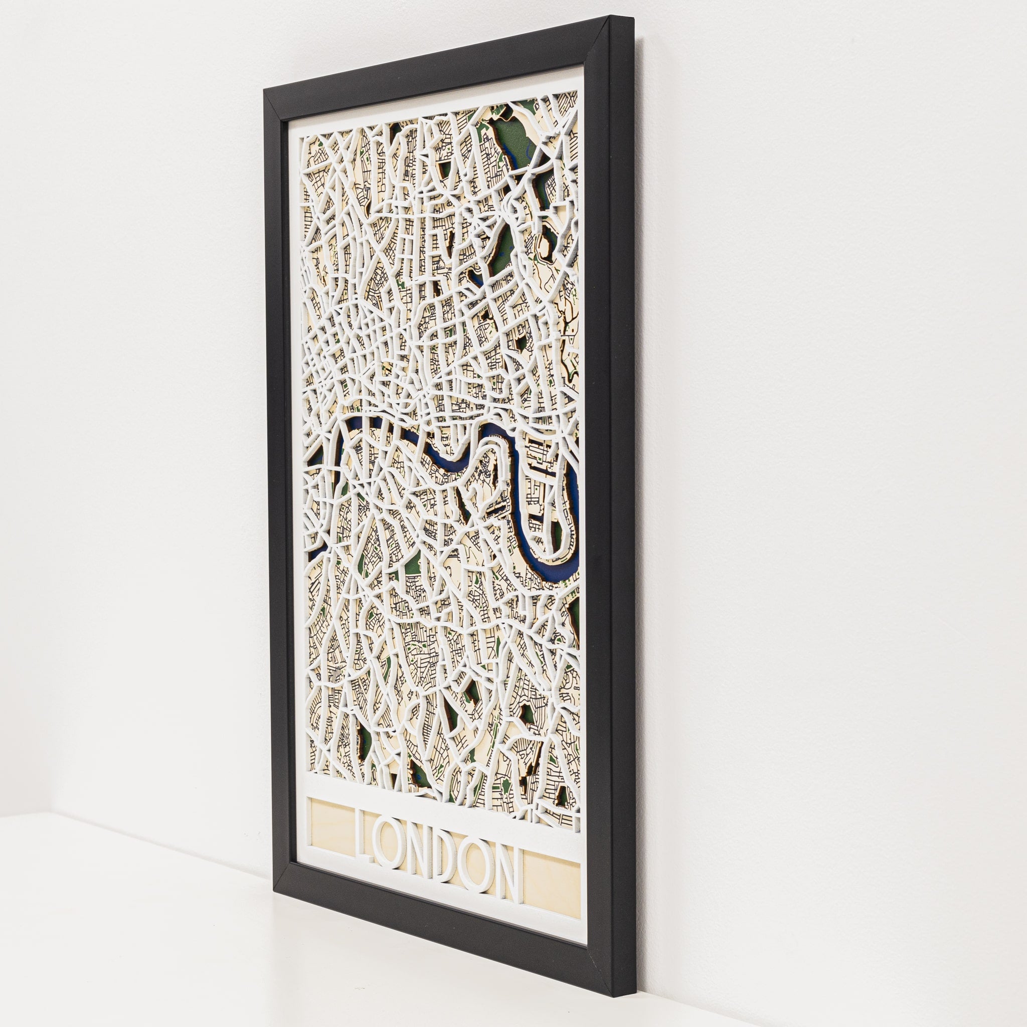 Framed map of London on a white wall
